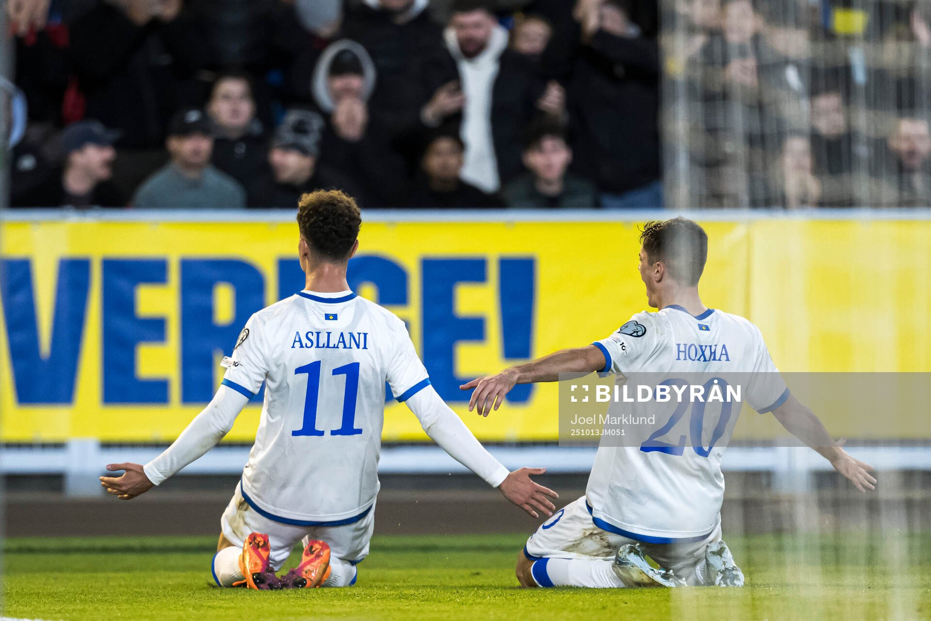 Fisnik Asllani and Veldin Hodža of Kosovo celebrate the