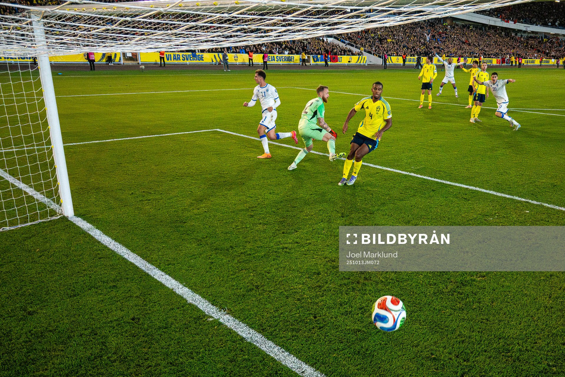Fisnik Asllani of Kosovo scores 0-1 behind goalkeeper