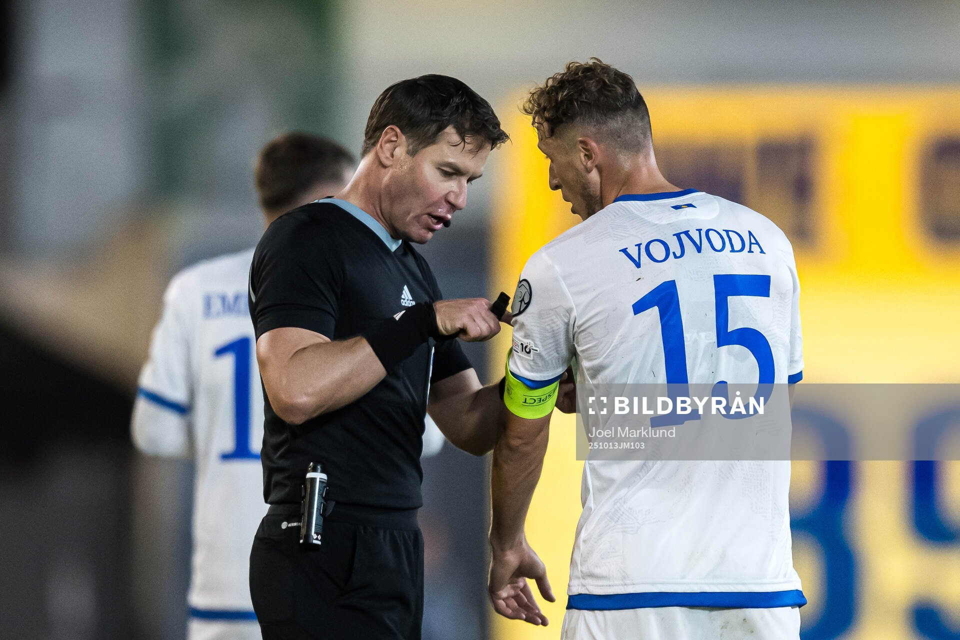 Referee Danny Makkelie and Mergim Vojvoda of Kosovo