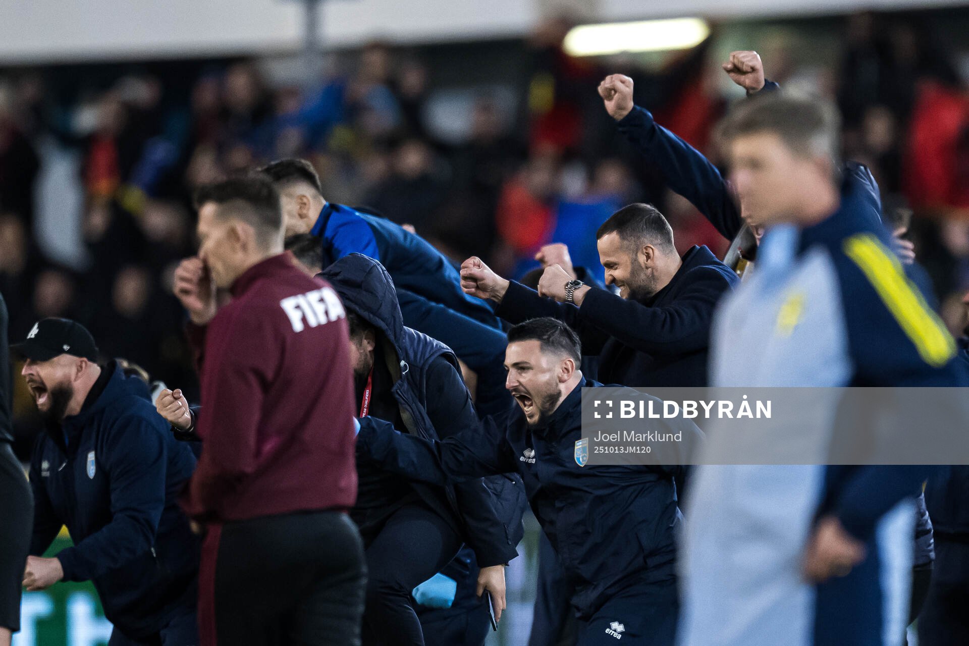 Team Kosovo celebrates behind Head coach Jon Dahl Tomasson