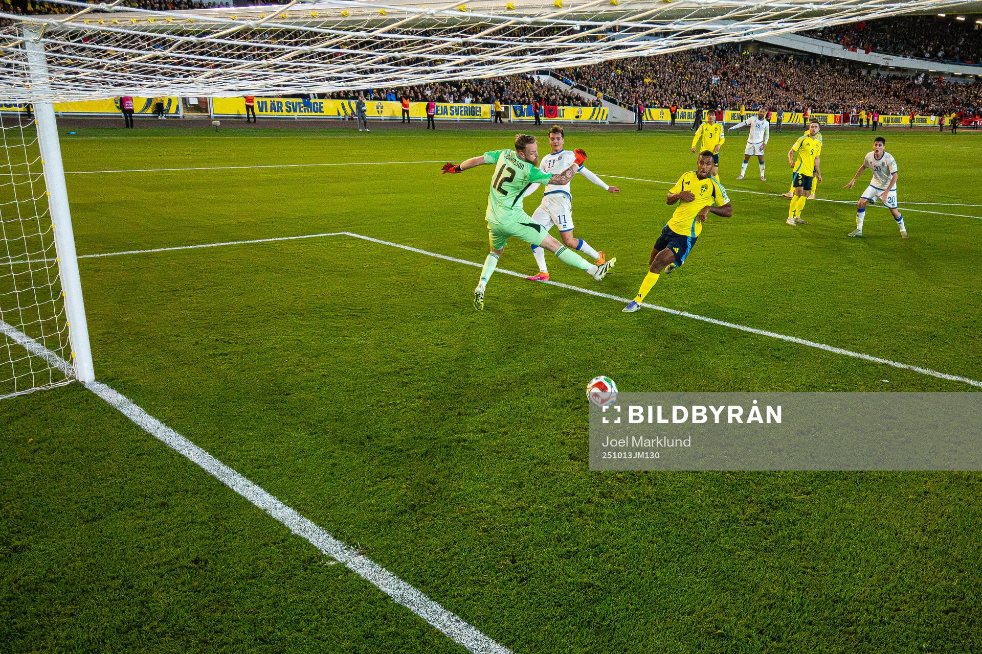 Fisnik Asllani of Kosovo scores 0-1 behind goalkeeper