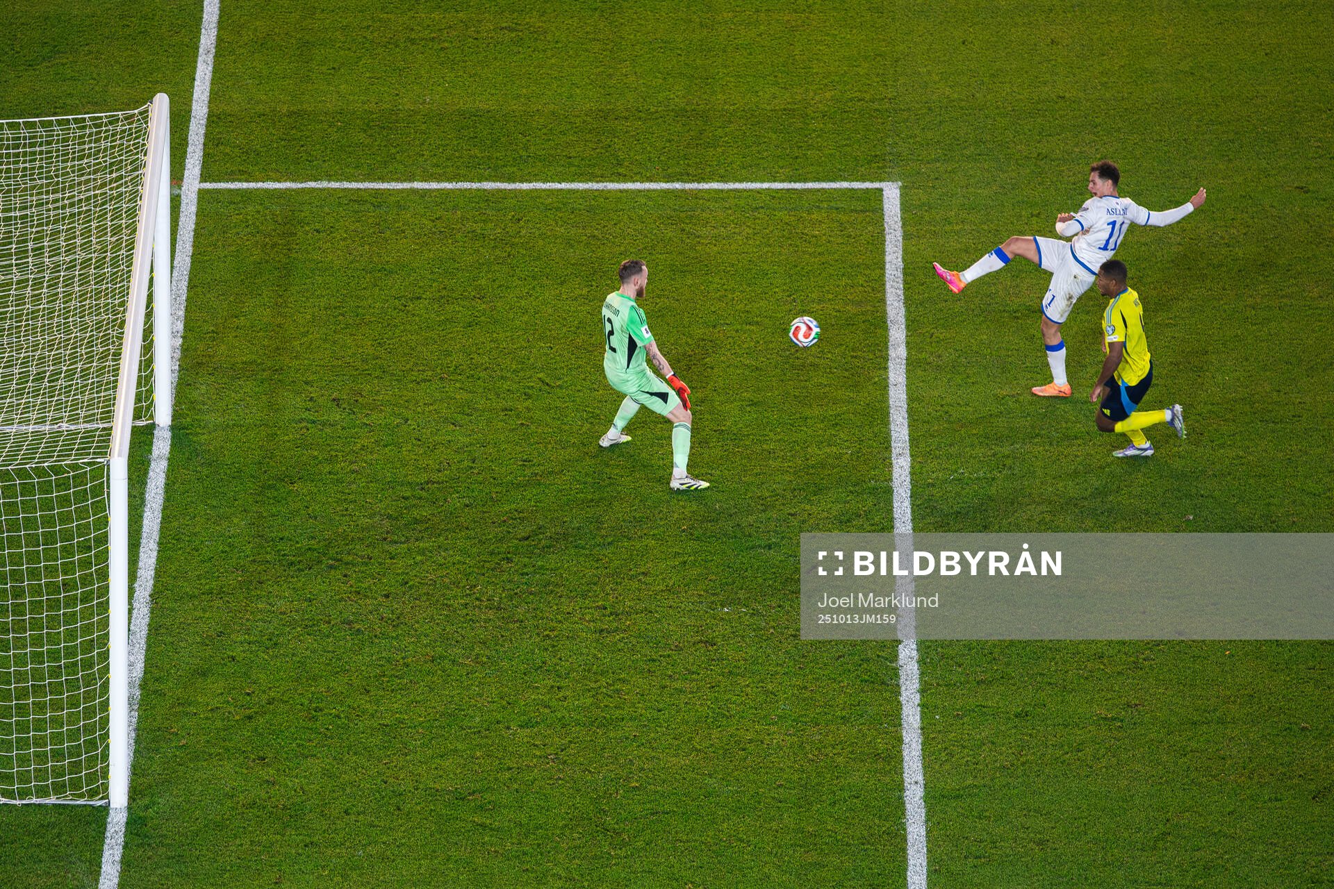 Fisnik Asllani of Kosovo scores 0-1 behind goalkeeper