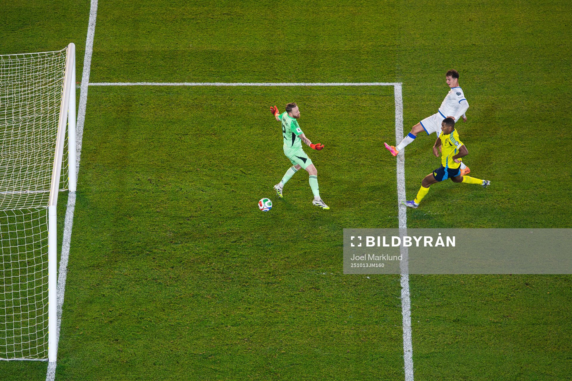 Fisnik Asllani of Kosovo scores 0-1 behind goalkeeper