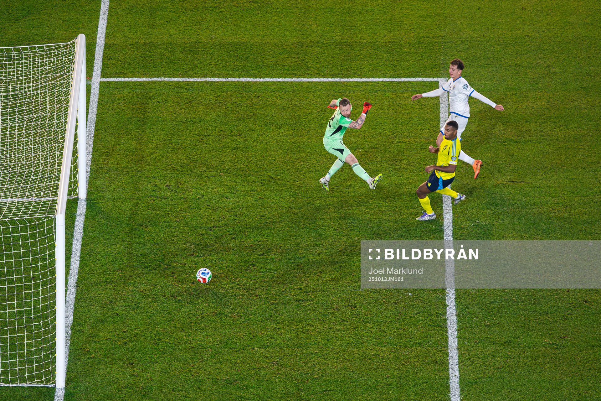 Fisnik Asllani of Kosovo scores 0-1 behind goalkeeper