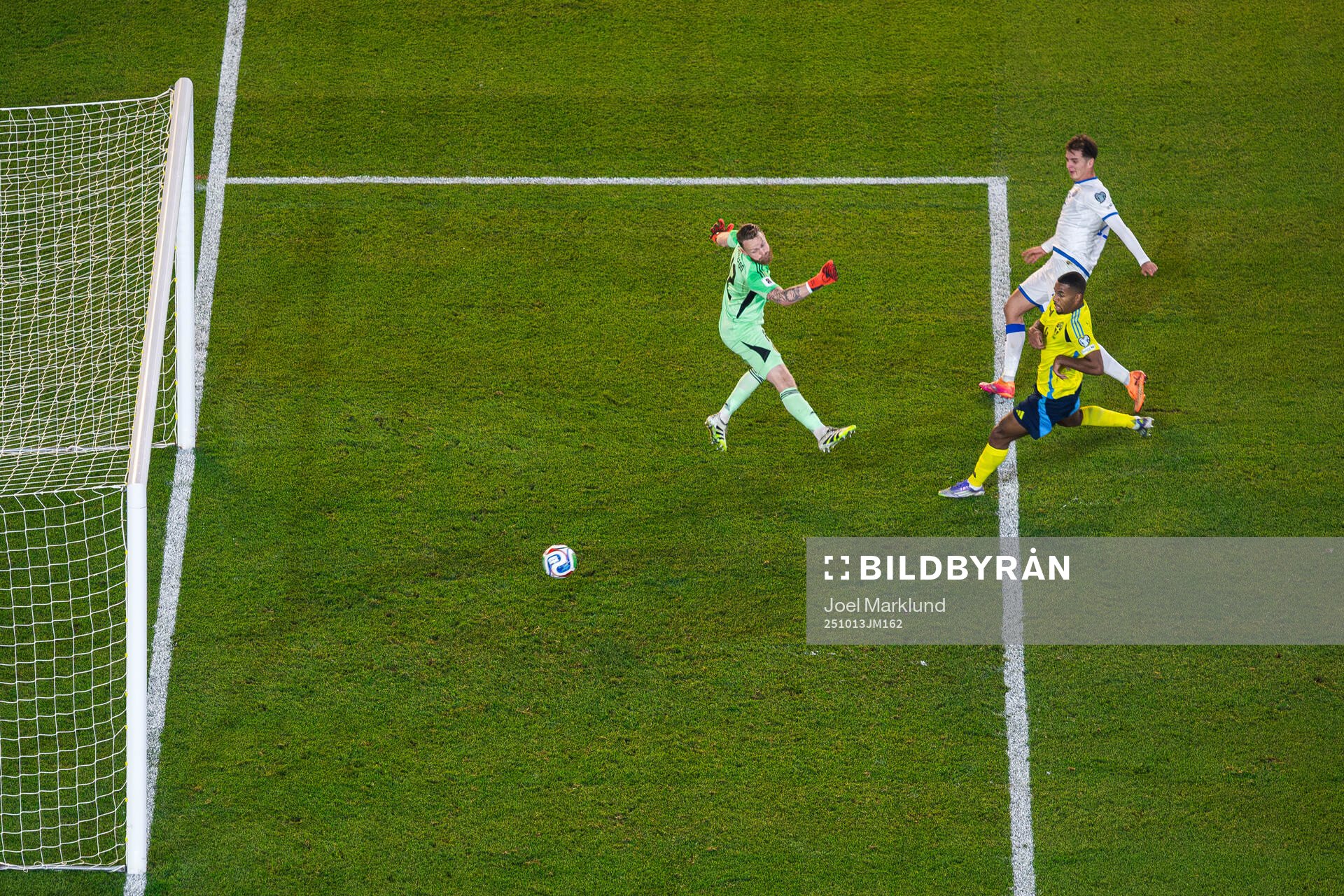 Fisnik Asllani of Kosovo scores 0-1 behind goalkeeper