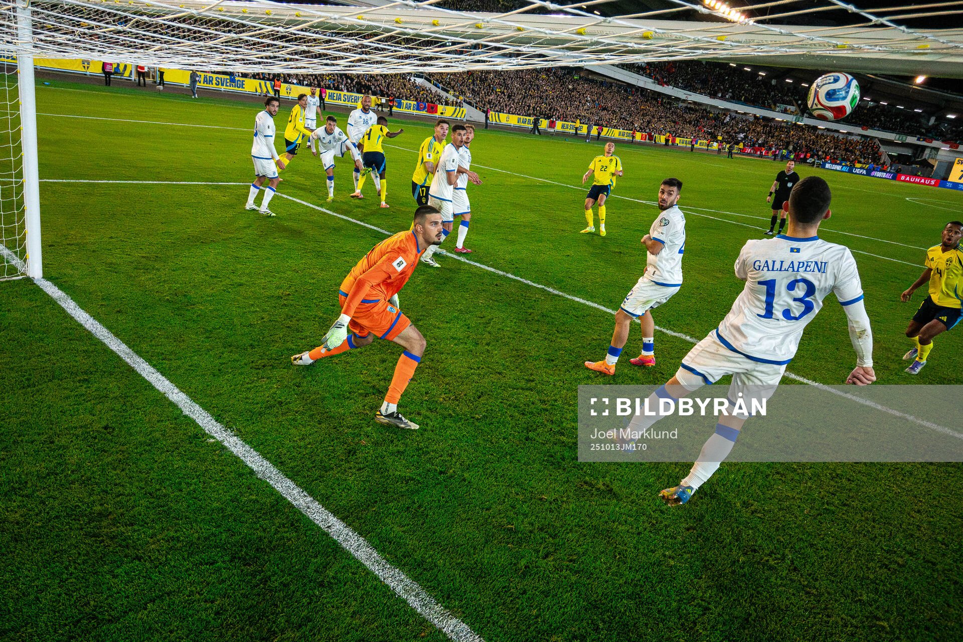 Goalkeeper Arijanet Muric sees Dion Gallapeni of Kosovo