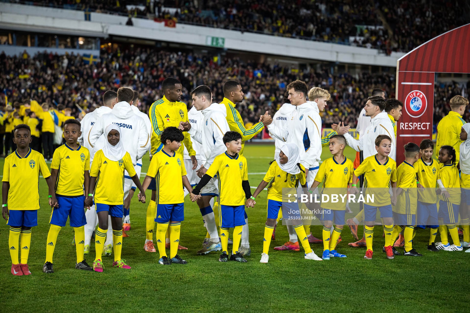 Mascots in front of players of Sweden and Kosovo