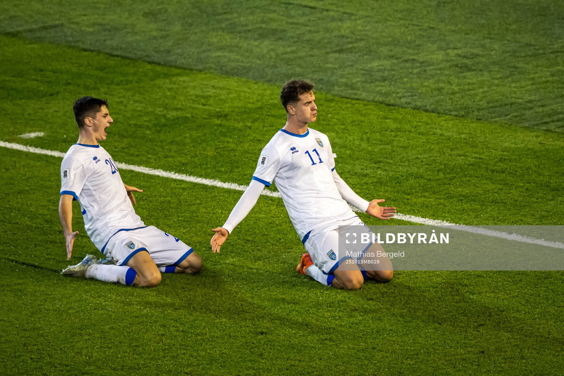 Veldin Hodža and Fisnik Asllani of Kosovo celebrate the