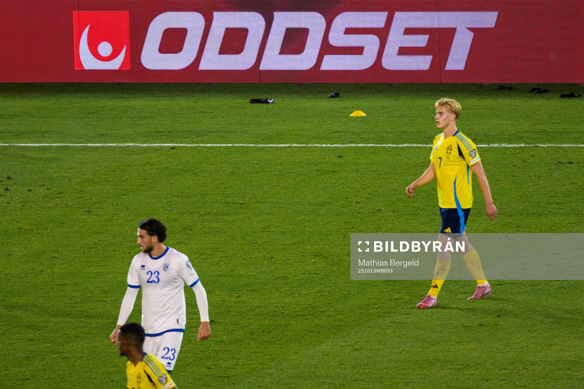 An add for Svenska Spels Oddset is seen behind Lucas