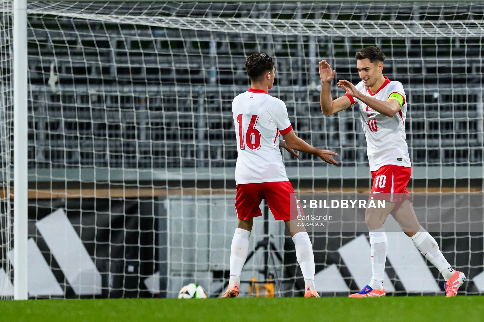 Tomasz Pienko of Poland celebrate with Kacper Urbanski