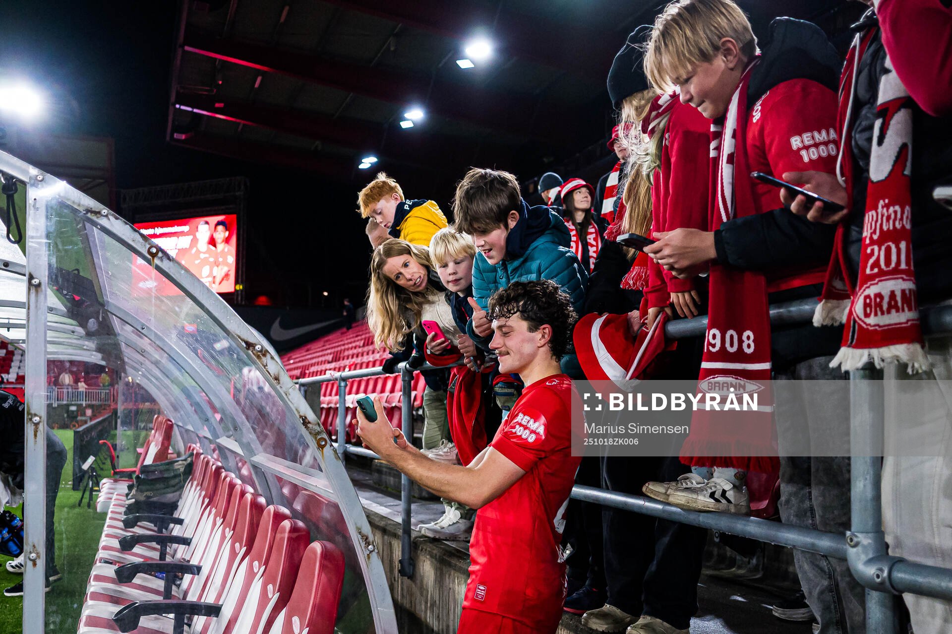 Denzel De Roeve of Brann taking a selfie with fans