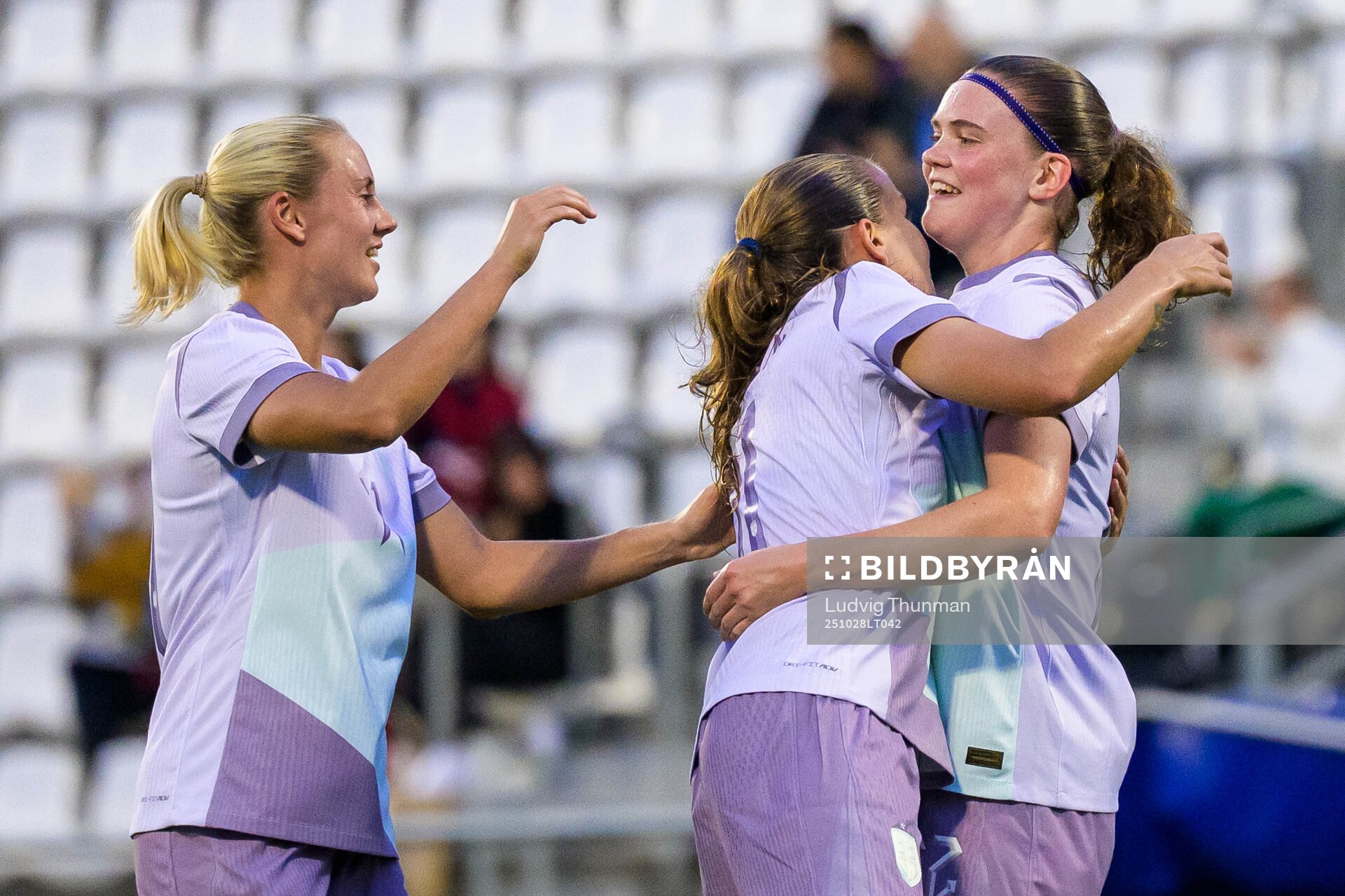 Lisa Naalsund and Guro Reiten celebrate with Signe Gaupset
