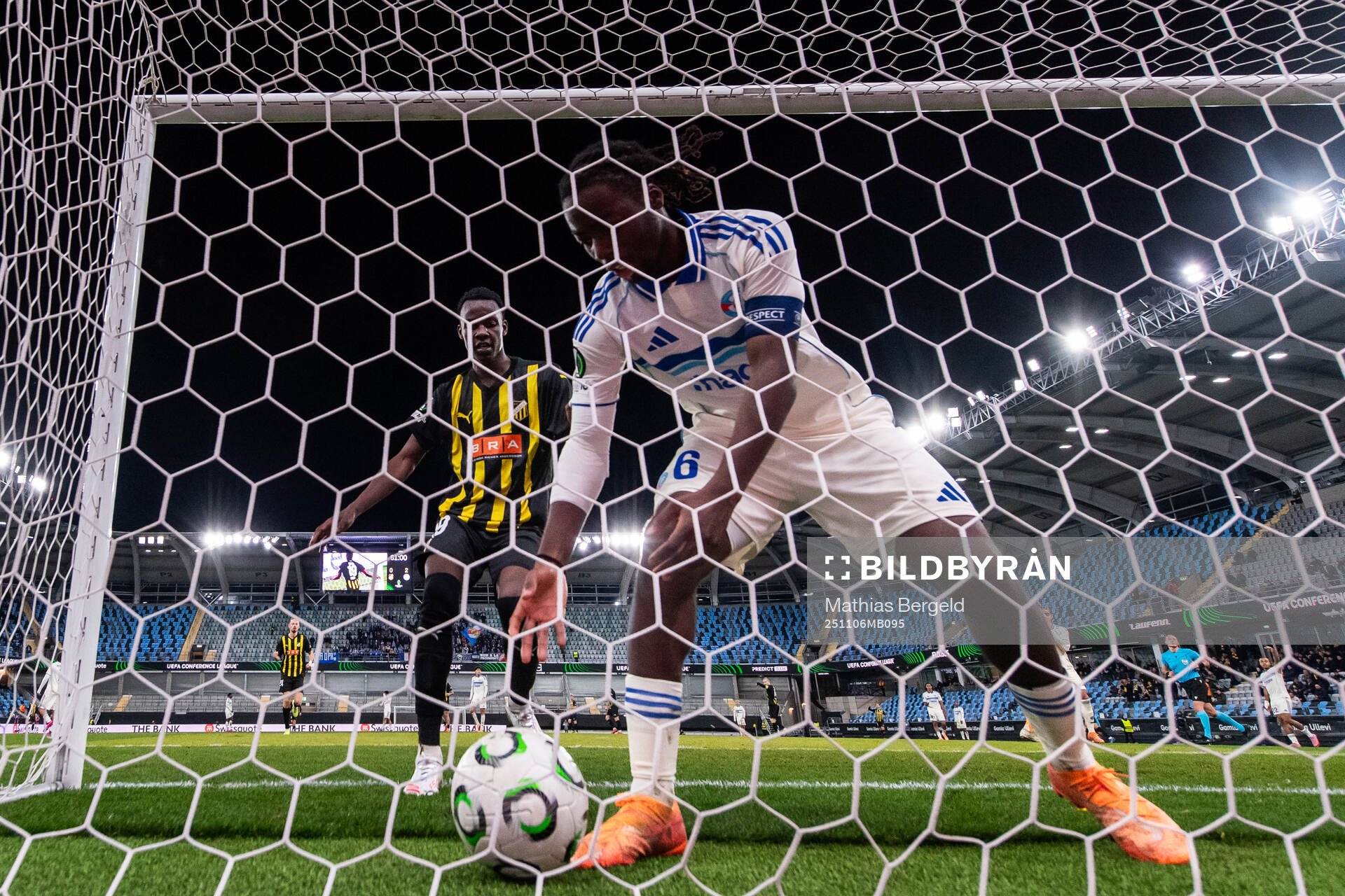 John Paul Dembe goes for the ball held by Ismael Doukoure