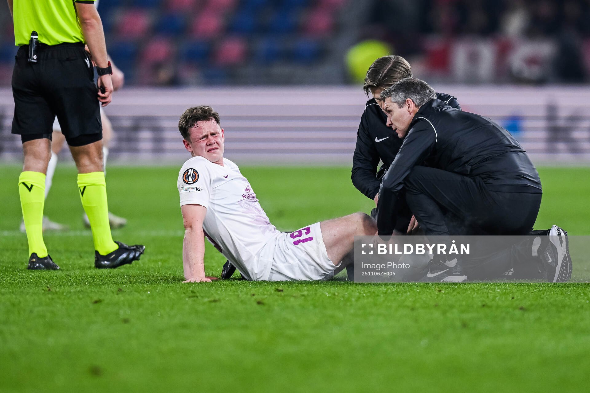 Eggert Aron Gudmundsson of Brann receives medical attention
