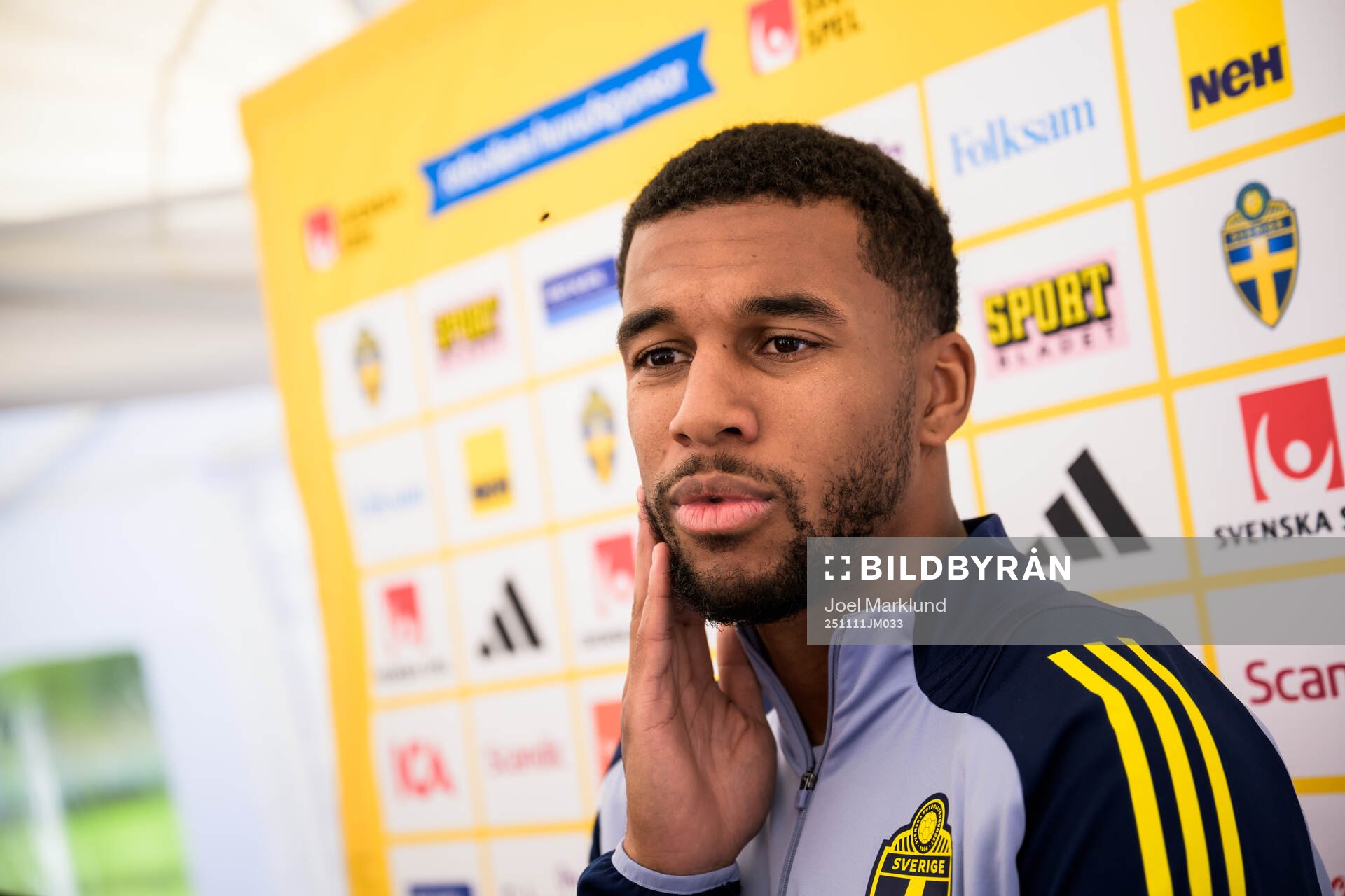 Isak Hien of the Swedish national football team talking to