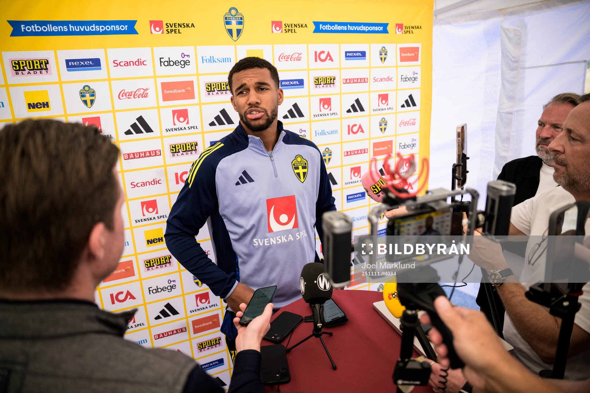 Isak Hien of the Swedish national football team talking to