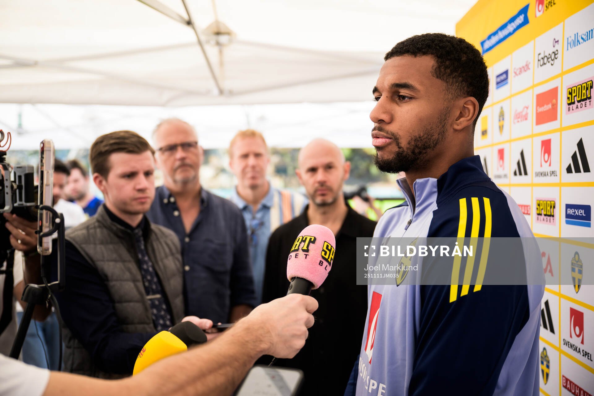 Isak Hien of the Swedish national football team talking to