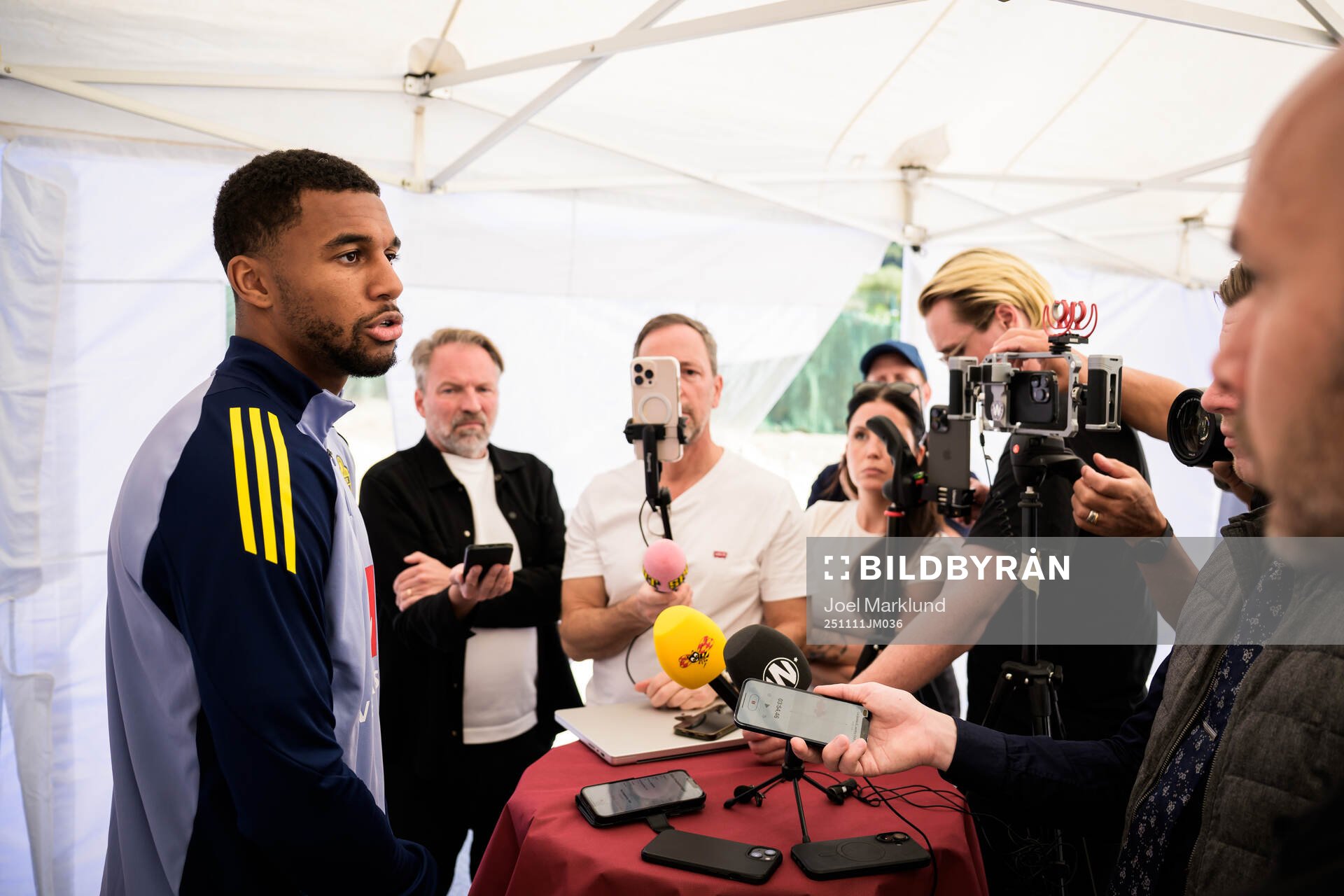 Isak Hien of the Swedish national football team talking to