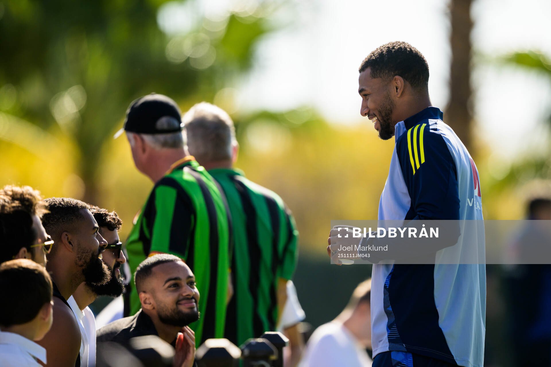 Isak Hien of the Swedish national football team interacting