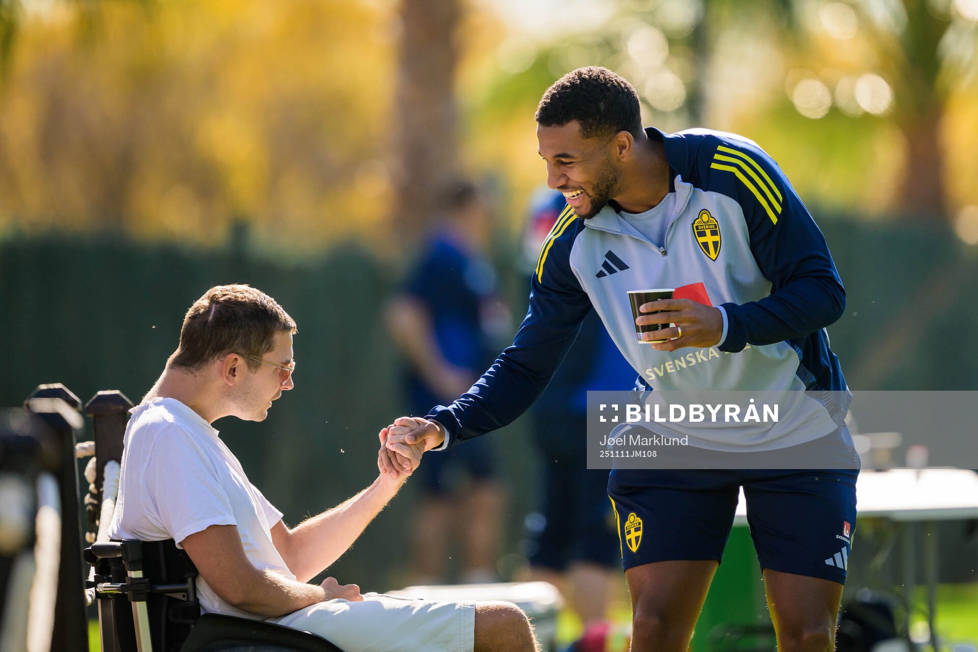 Isak Hien of the Swedish national football team greets a