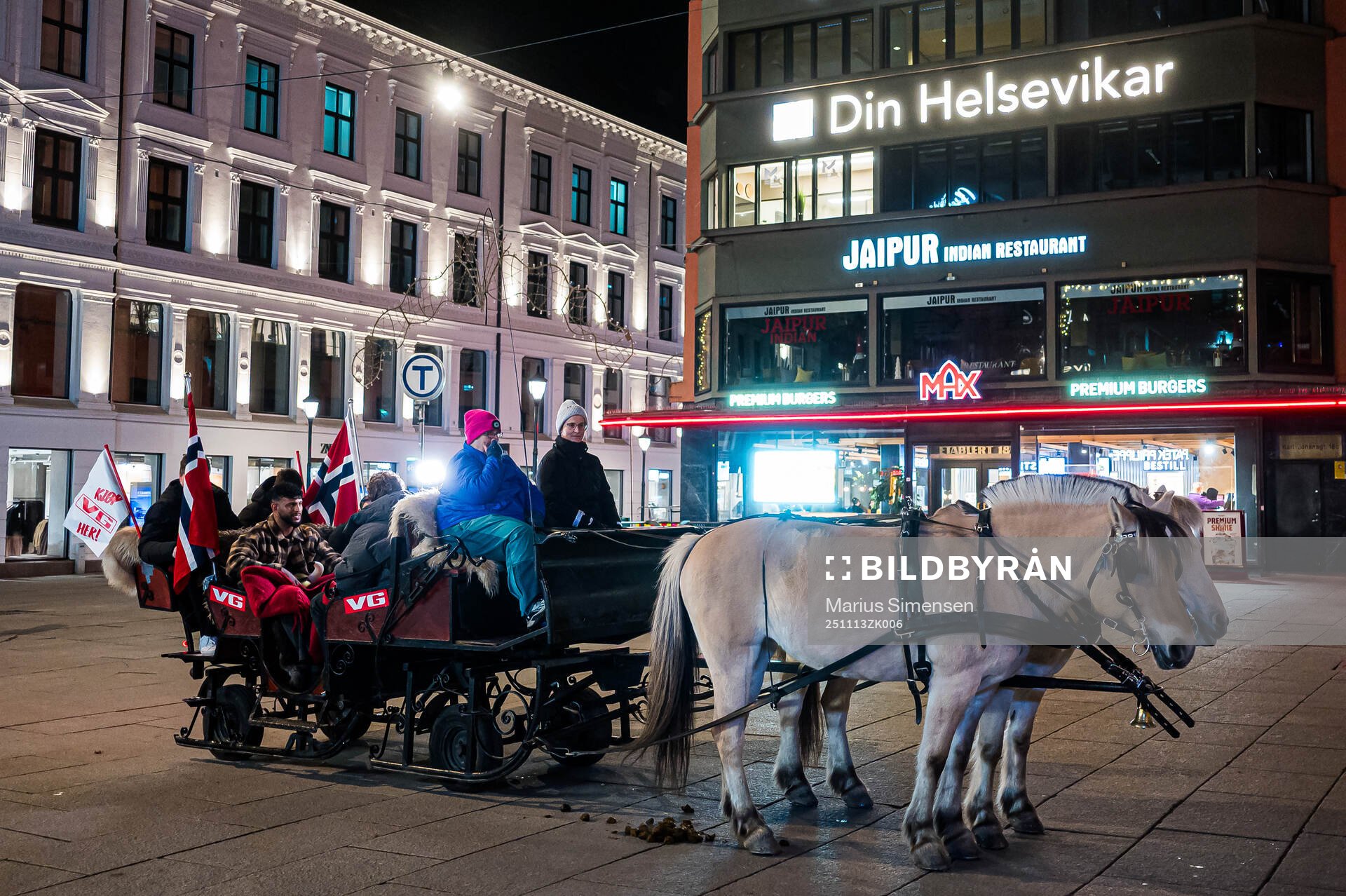 A horse with Norway flags at Karl Johans street