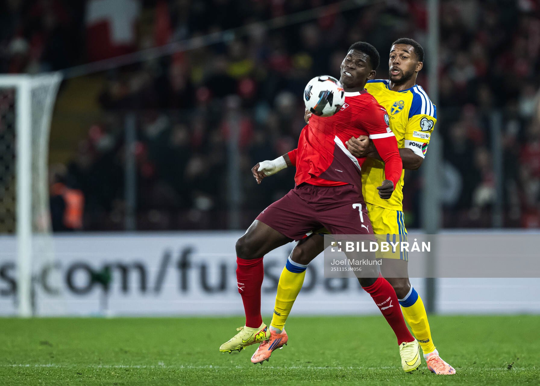 Breel Embolo of Switzerland and Isak Hien of Sweden