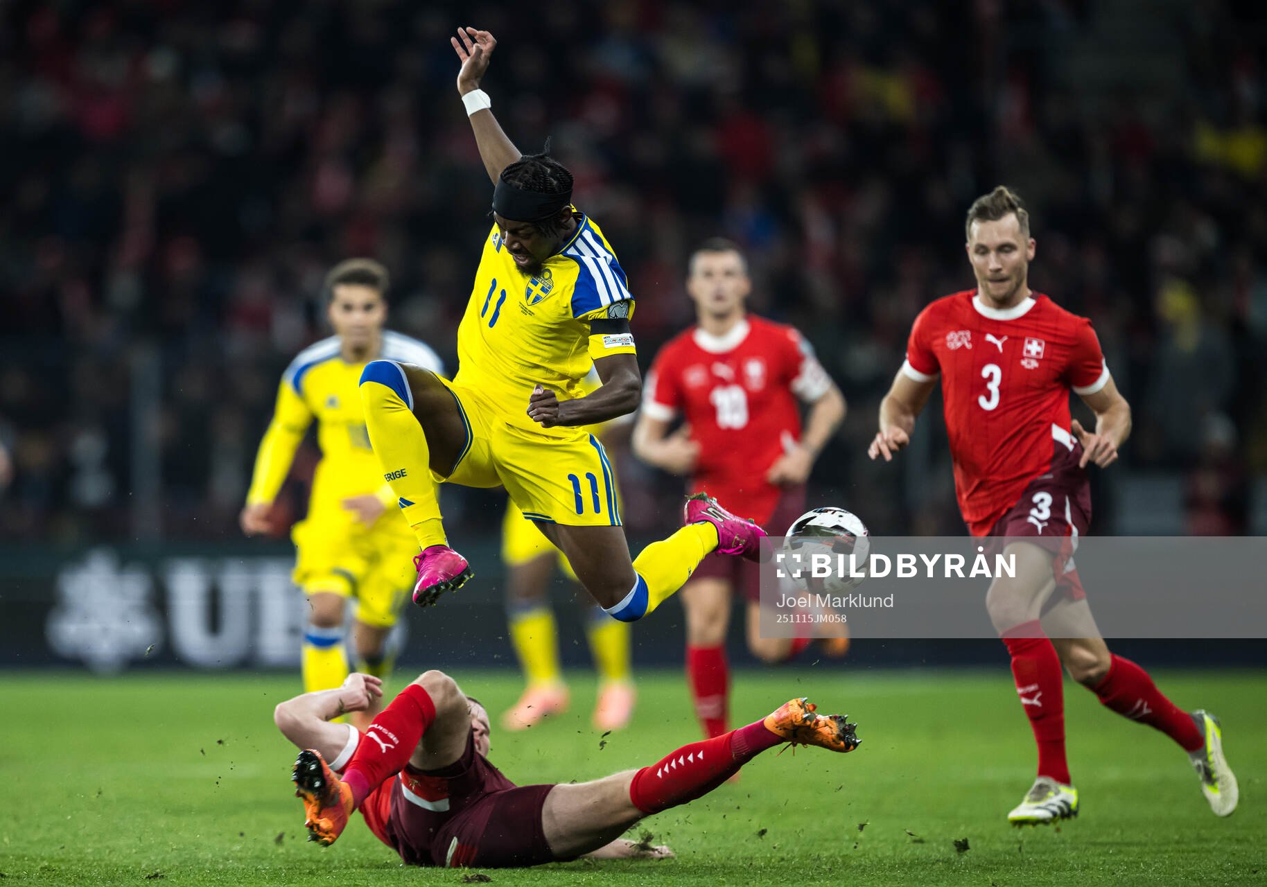 Nico Elvedi of Switzerland and Anthony Elanga of Sweden