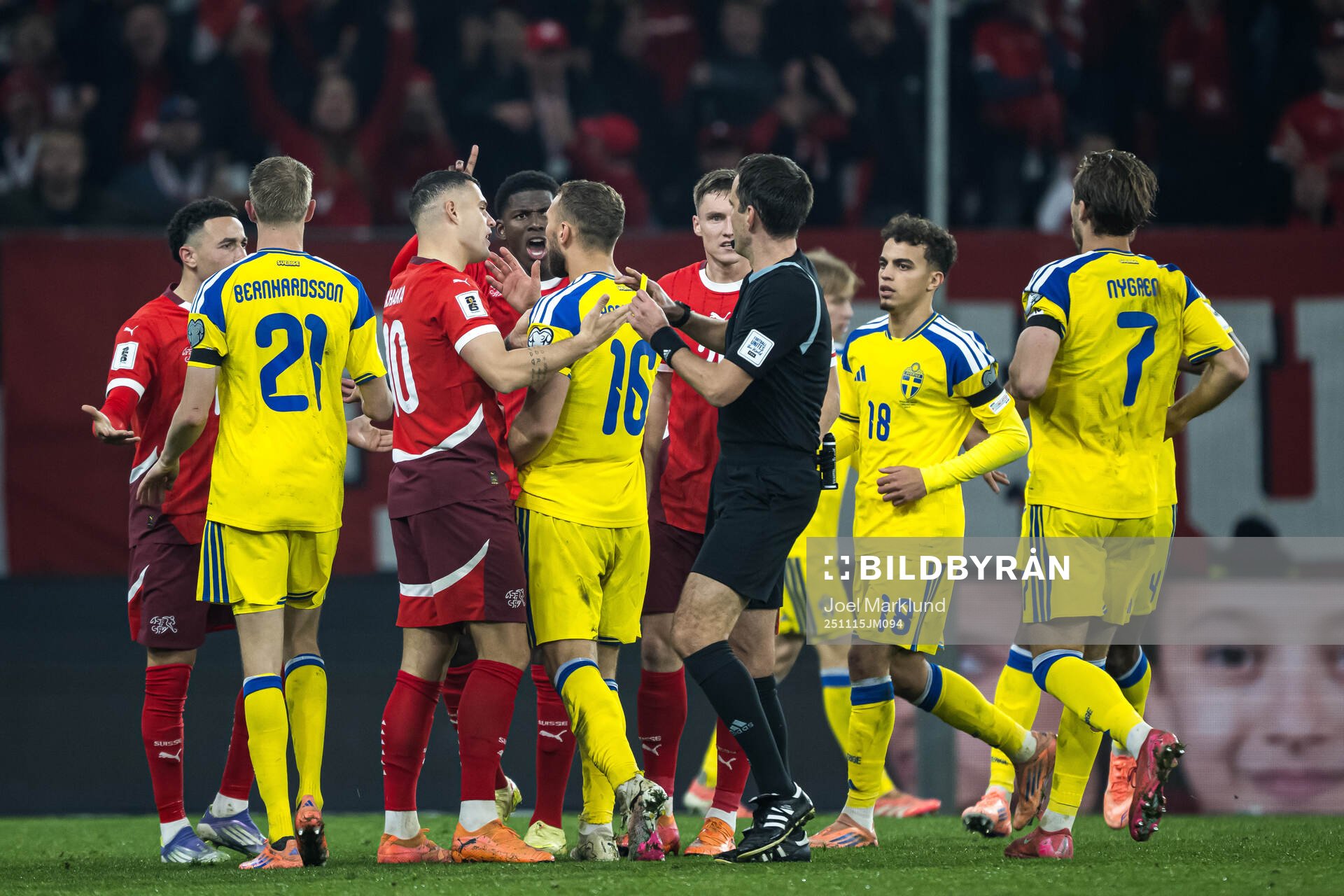 Jesper Karlström of Sweden receives a yellow card