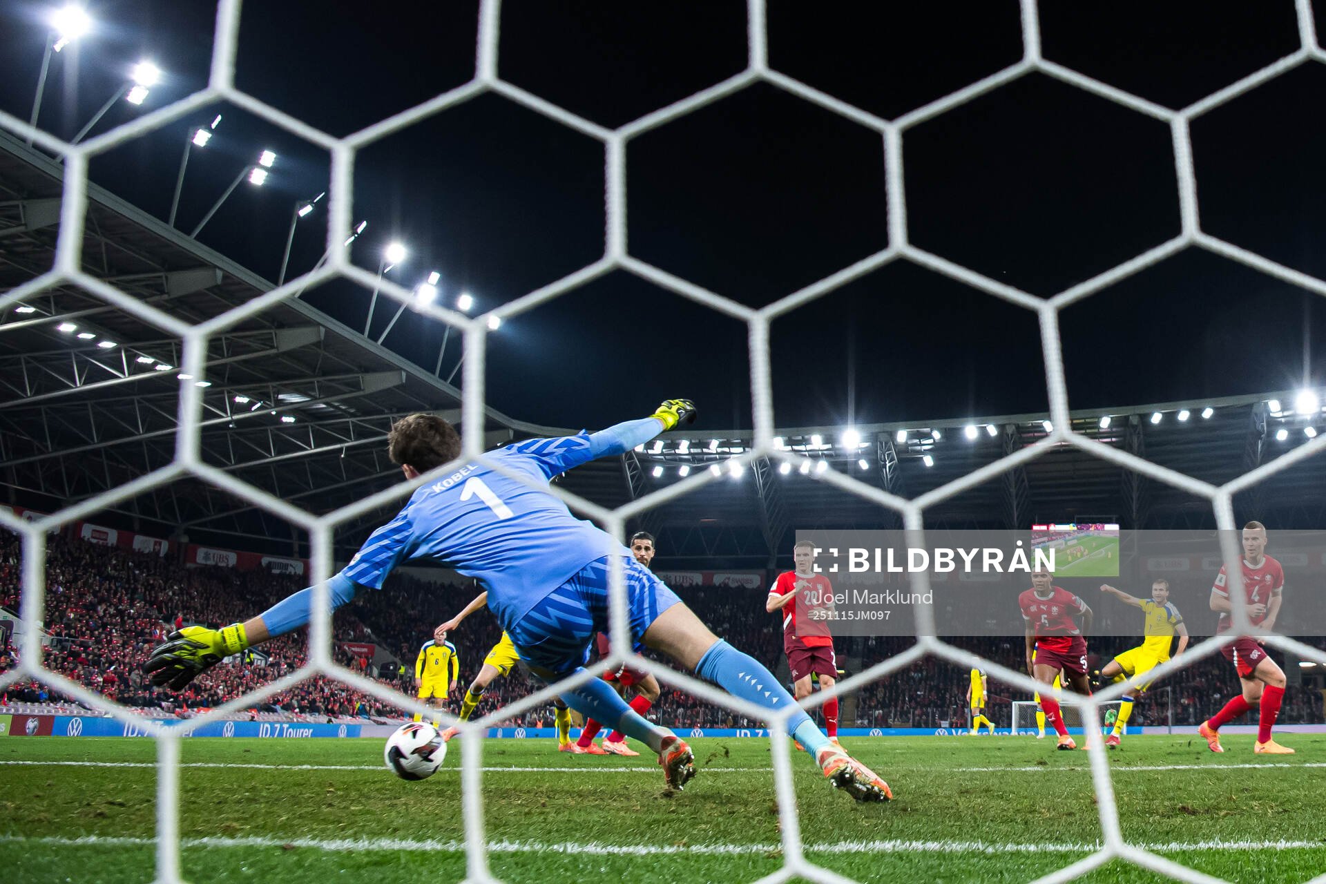 Benjamin Nygren of Sweden scores the 1-1 goal behind
