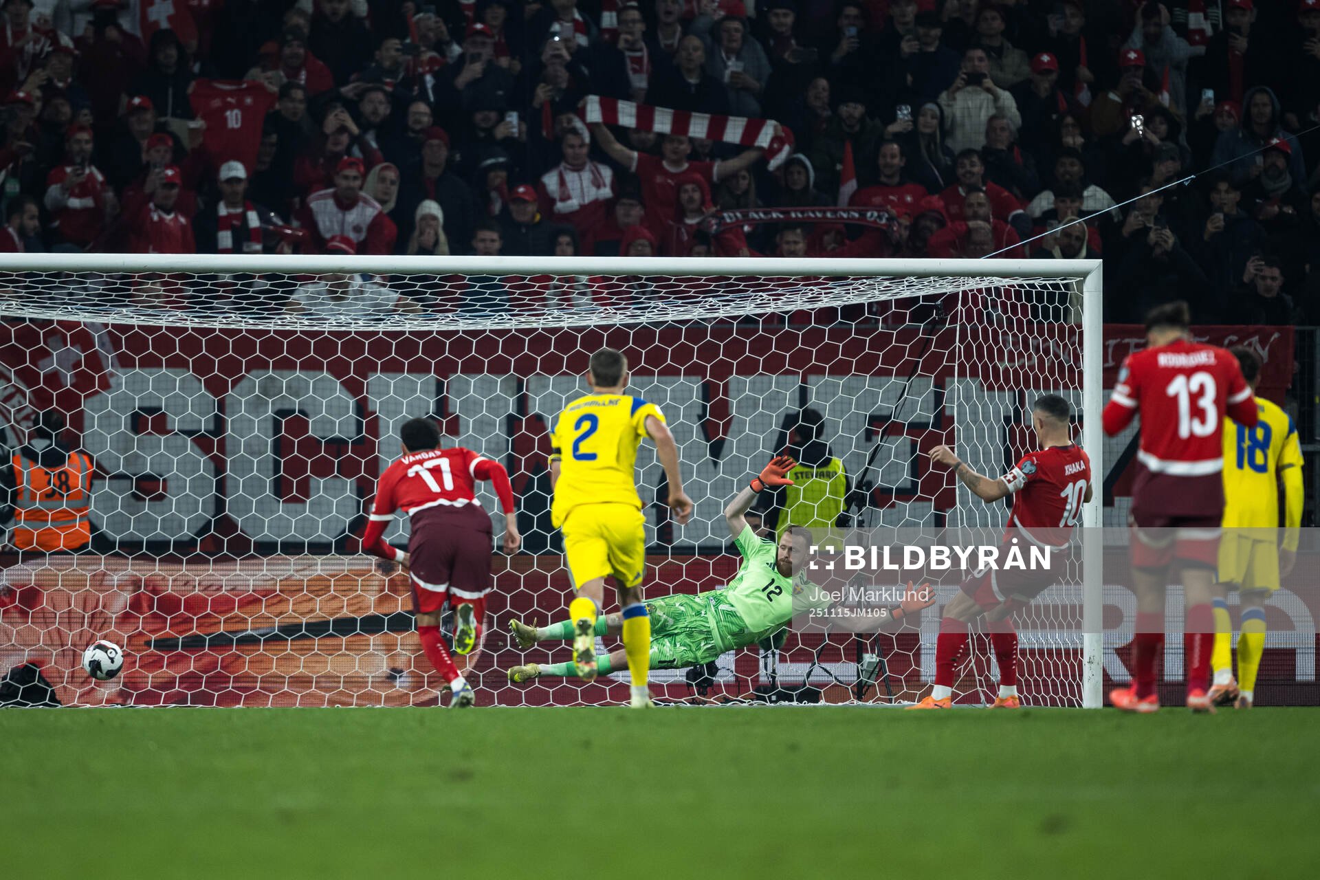 Granit Xhaka of Switzerland scores the 2-1 goal behind