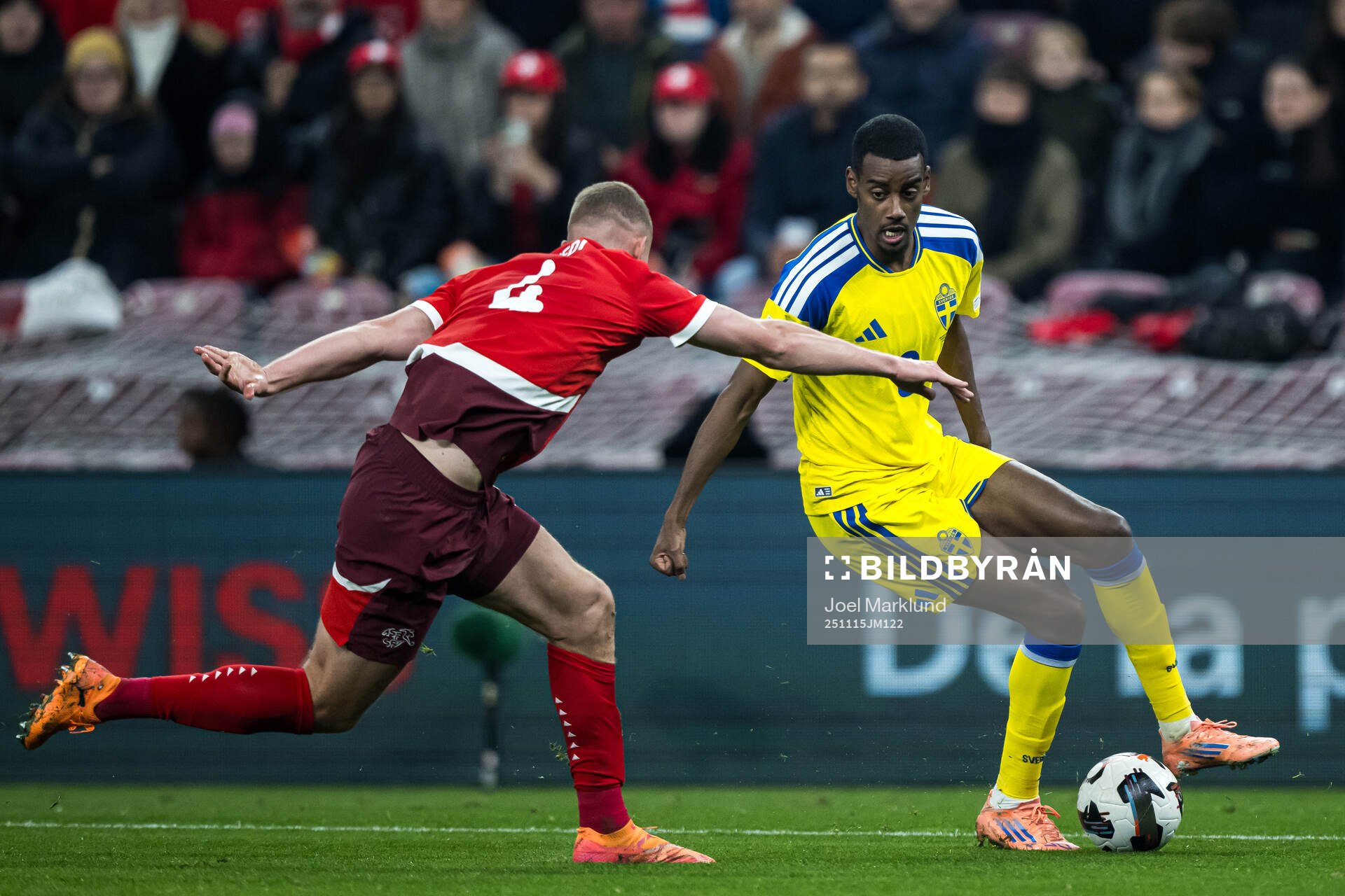 Nico Elvedi of Switzerland and Alexander Isak of Sweden