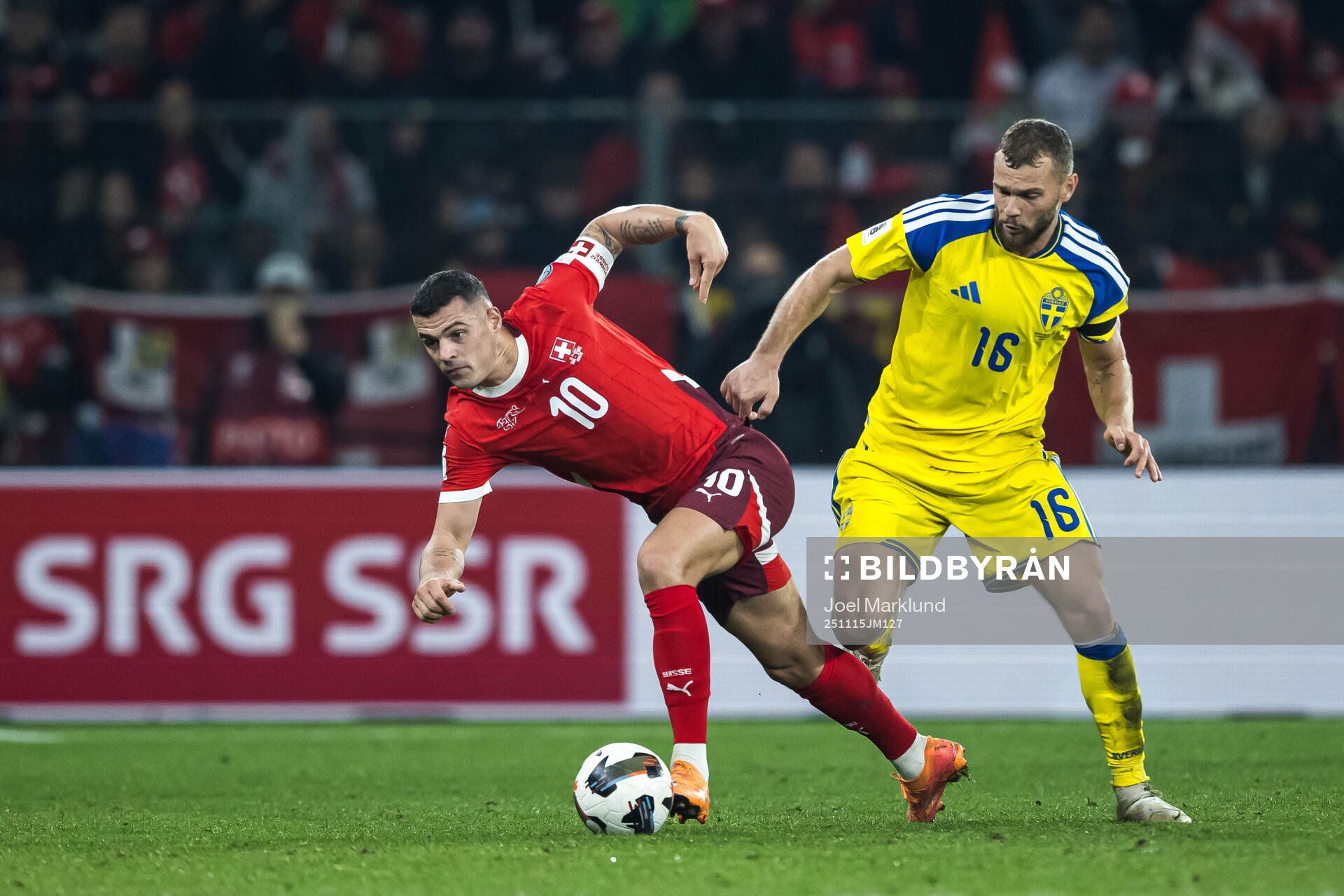 Granit Xhaka of Switzerland and Jesper Karlström of Sweden