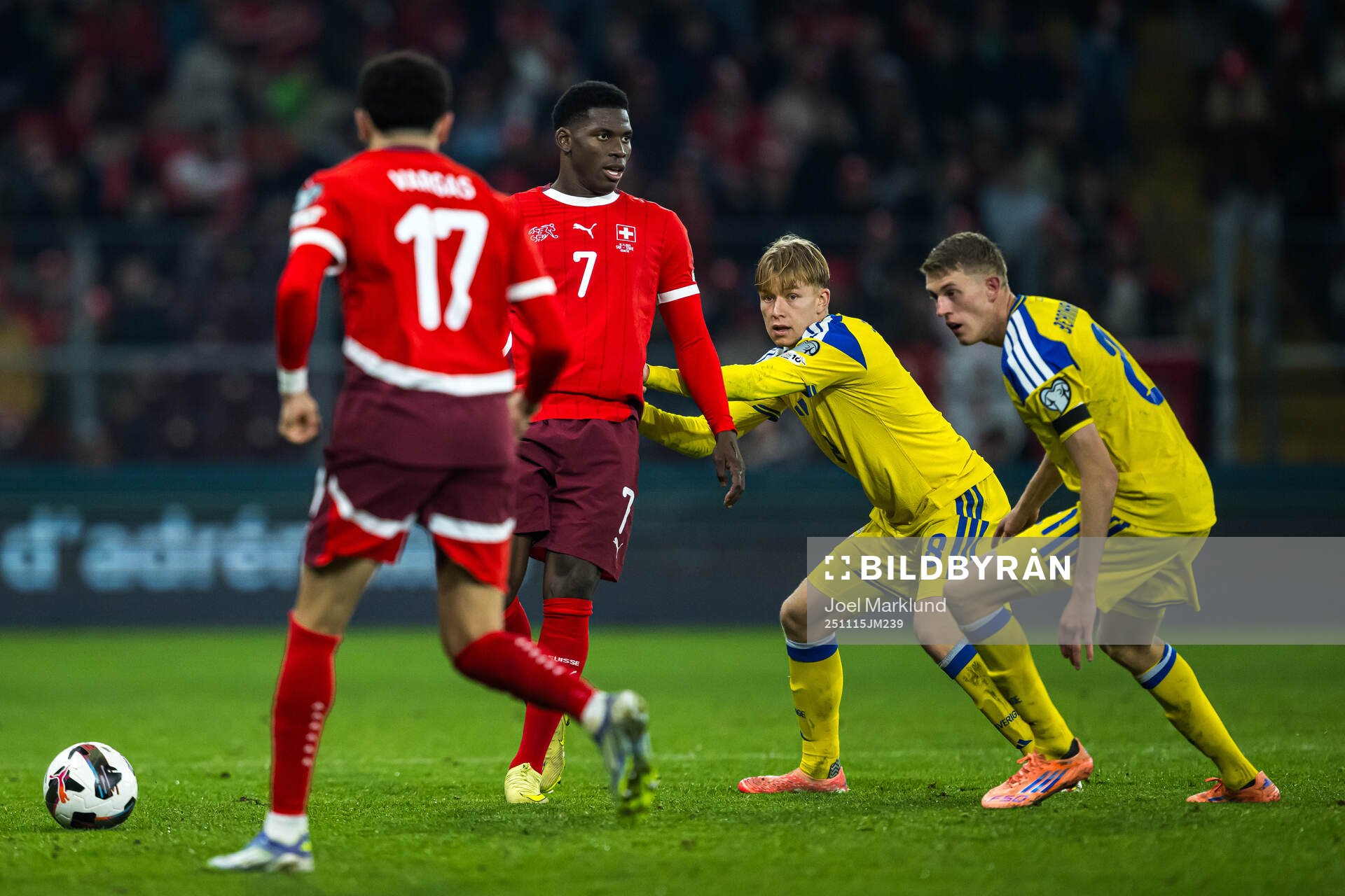 Ruben Vargas and Breel Embolo of Switzerland are being