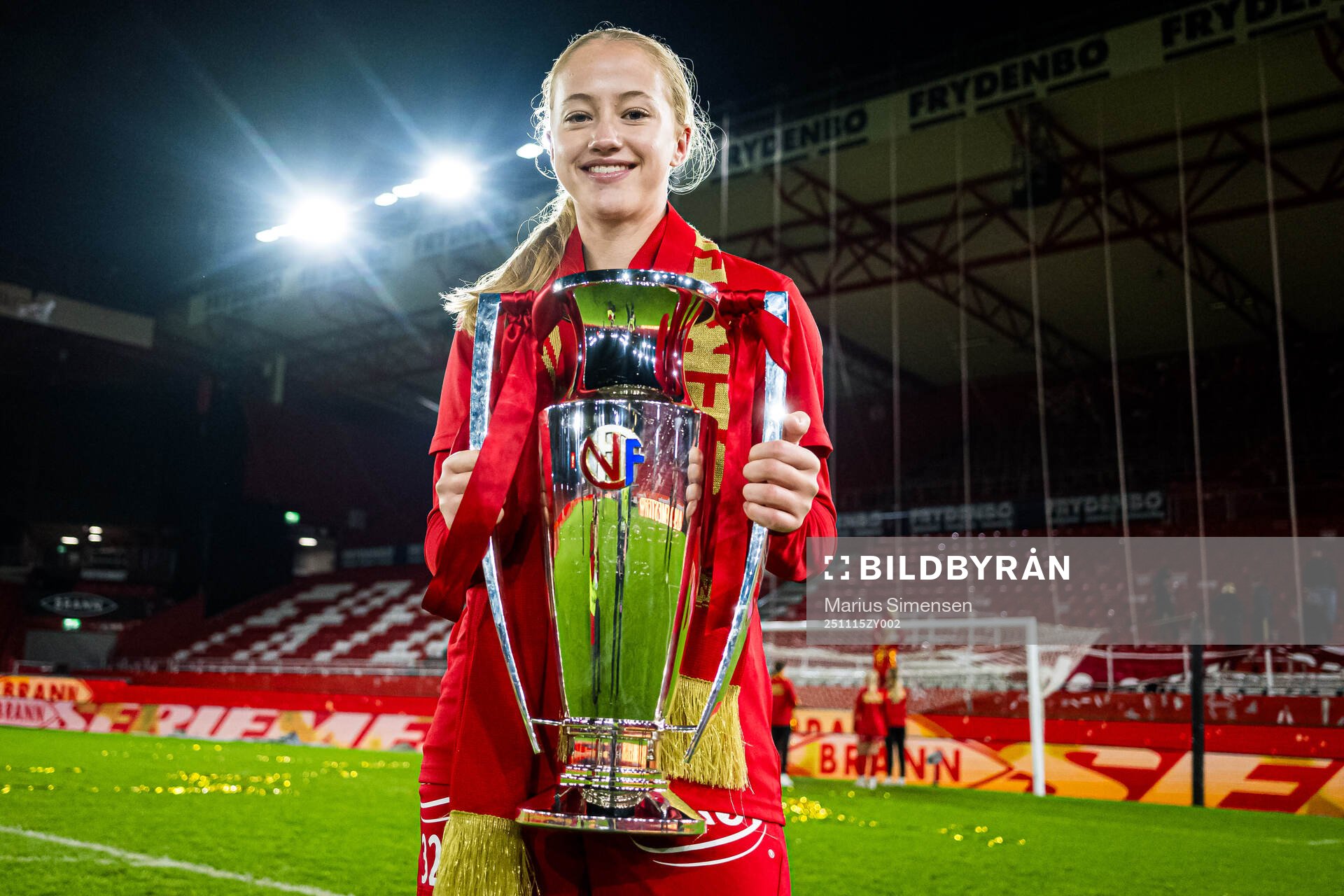 Maren Johnsen of Brann celebrates with the trophy