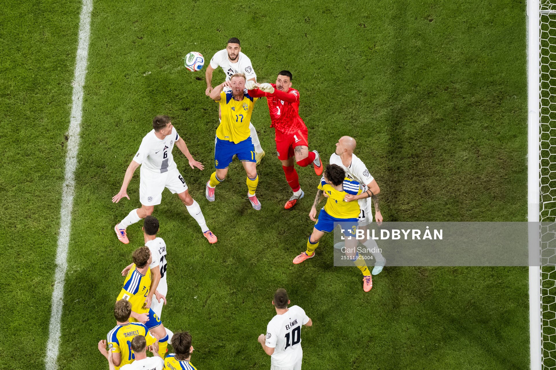 Isac Lidberg of Sweden and goalkeeper Igor Vekic of Slovenia
