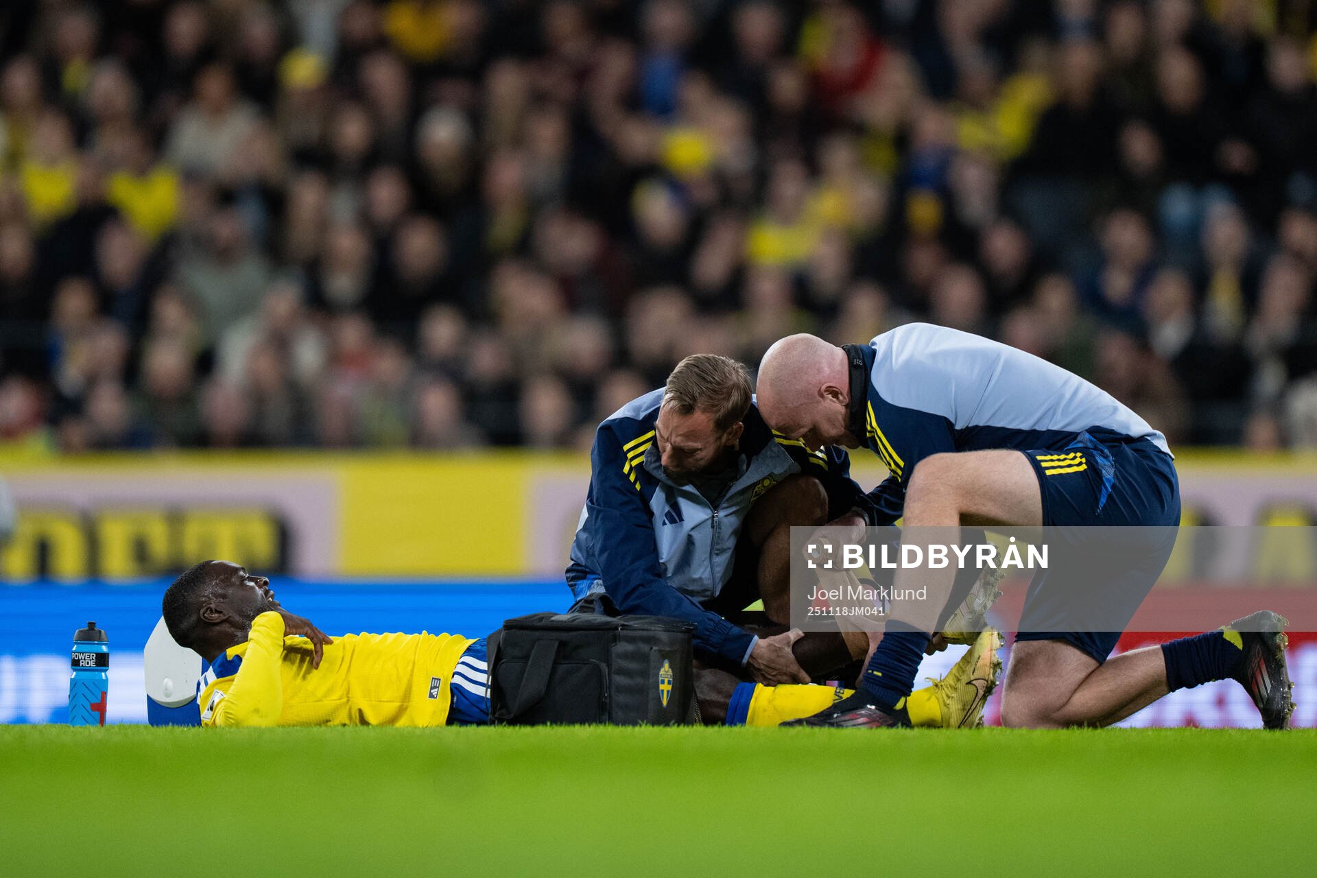 Ken Sema of Sweden receives medical attention