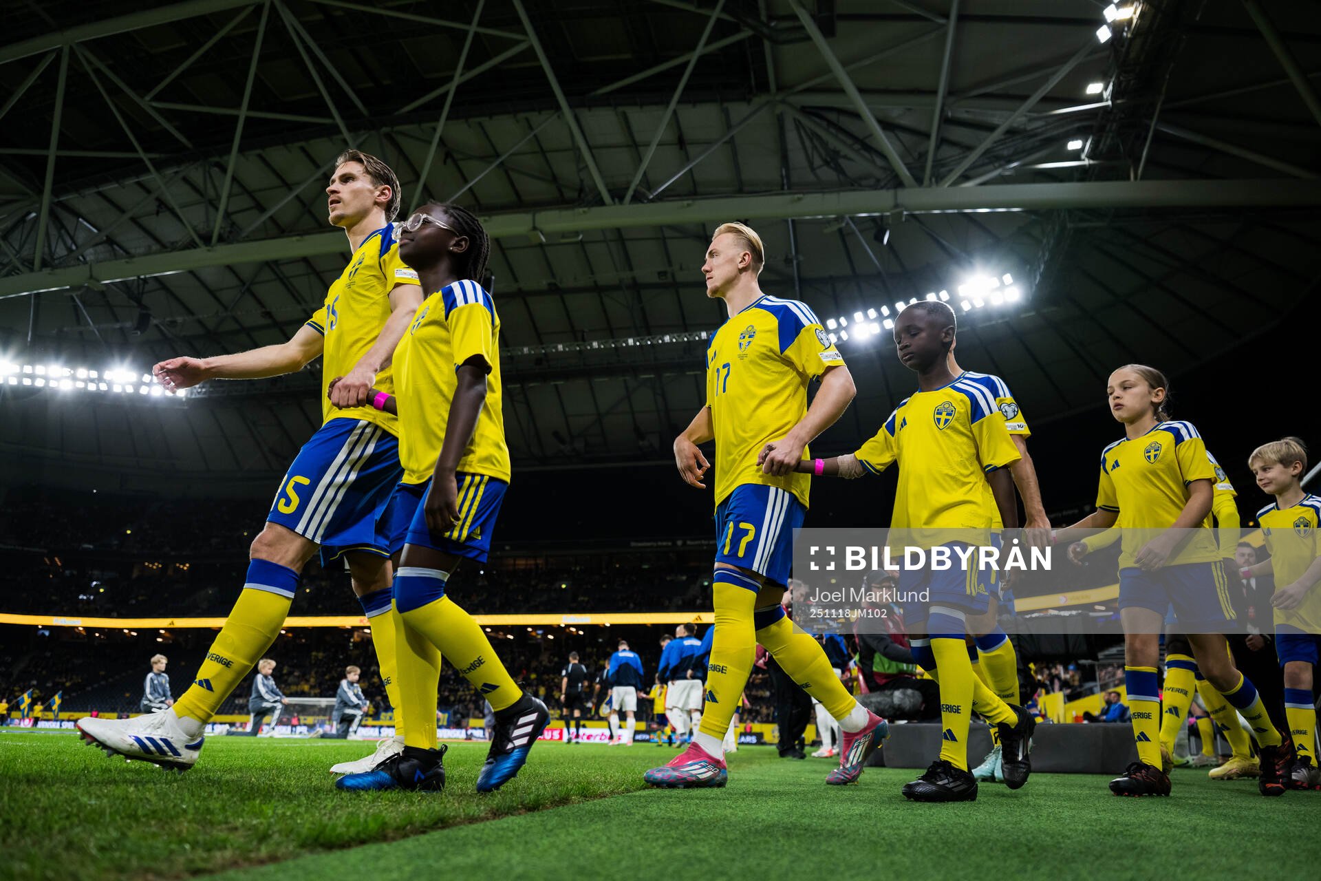 Carl Starfelt and Isac Lidberg of Sweden enter the pitch