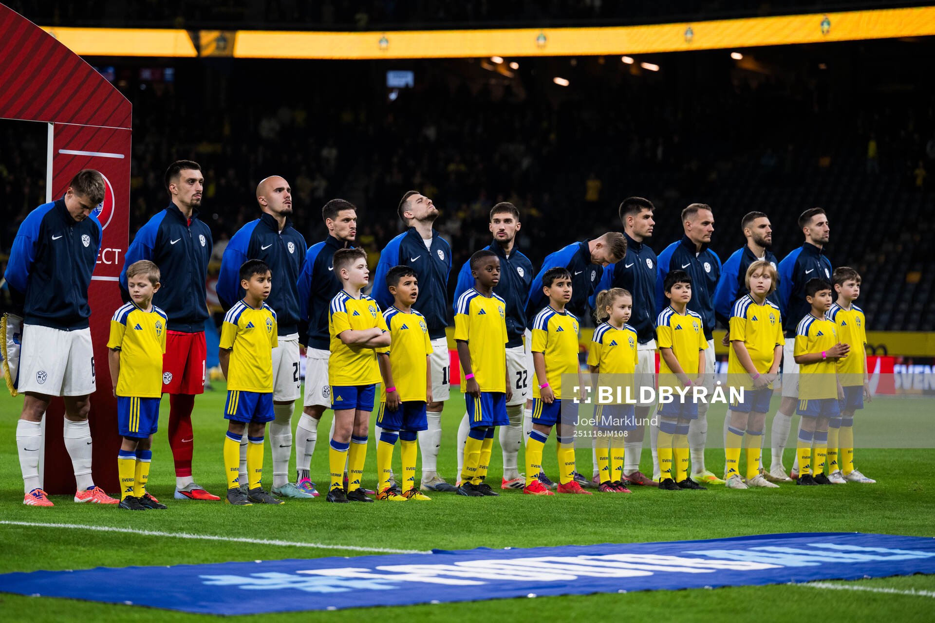 Players of Slovenia in front of mascots