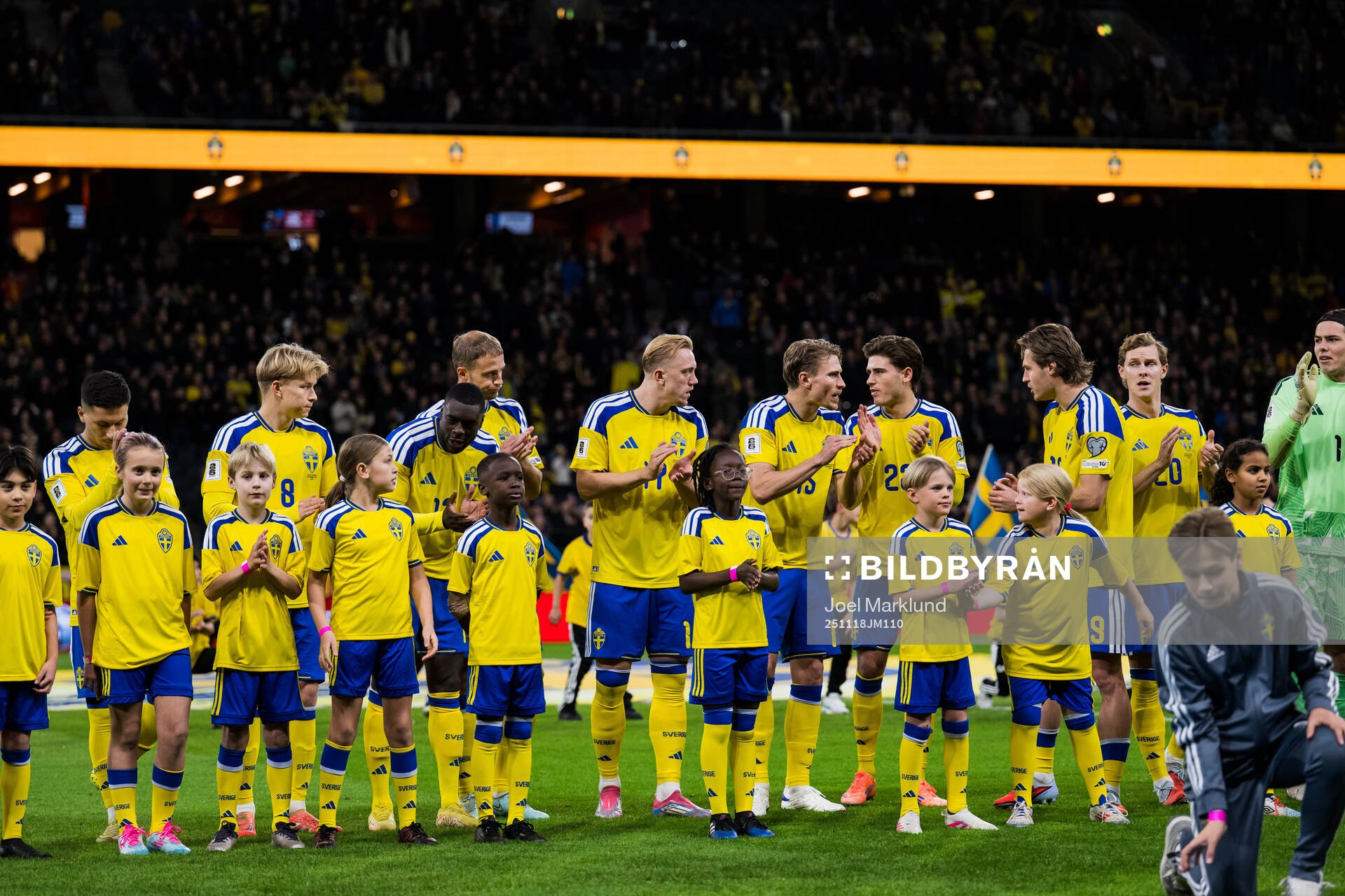 Players of Sweden in front of mascots