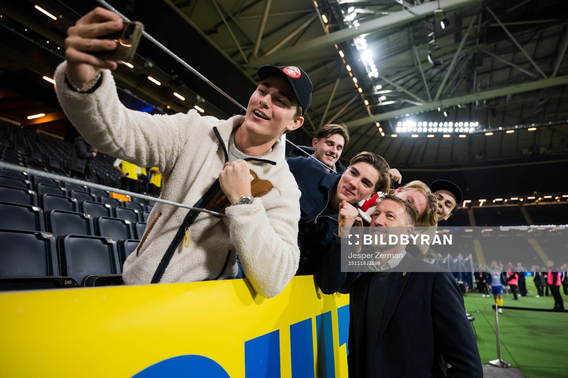 Head coach Graham Potter of Sweden takes a selfie with fans