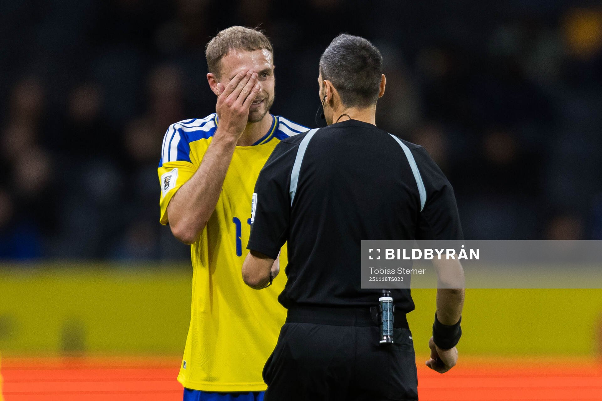 Gustav Lundgren of Sweden and referee Maurizio Mariani