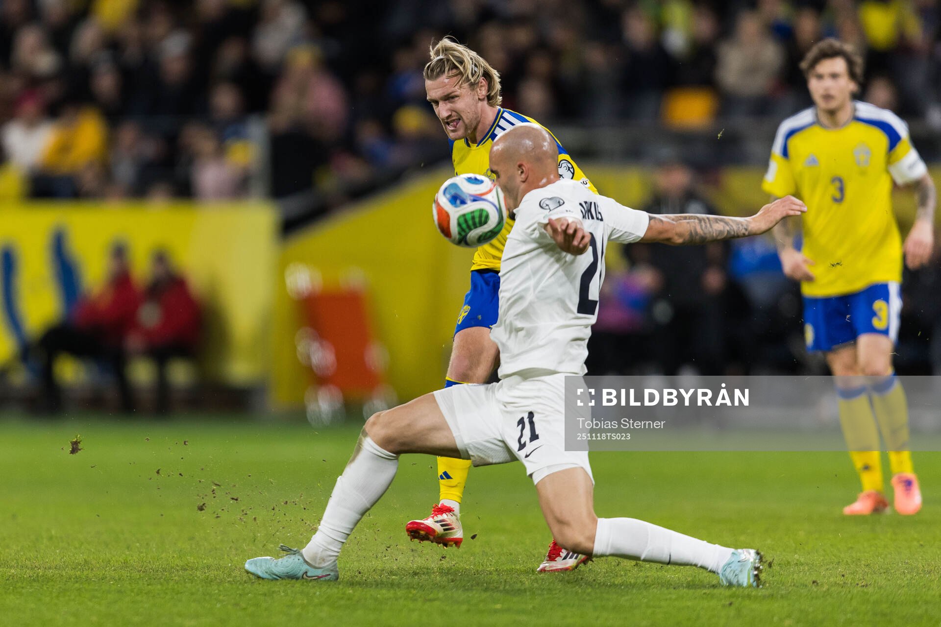 Emil Forsberg of Sweden and Vanja Drkusic of Slovenia