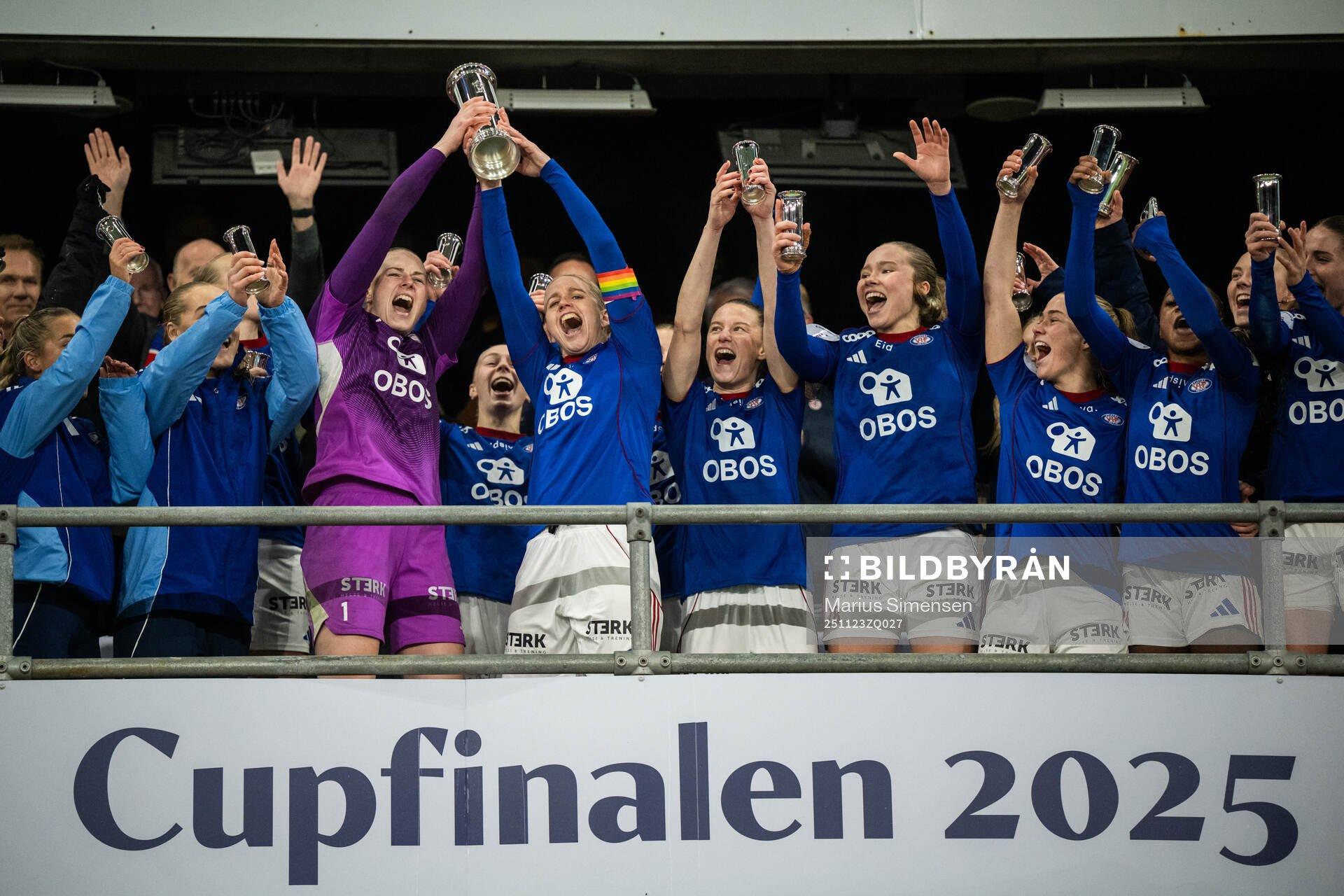 Players of Vålerenga celebrate with the trophy