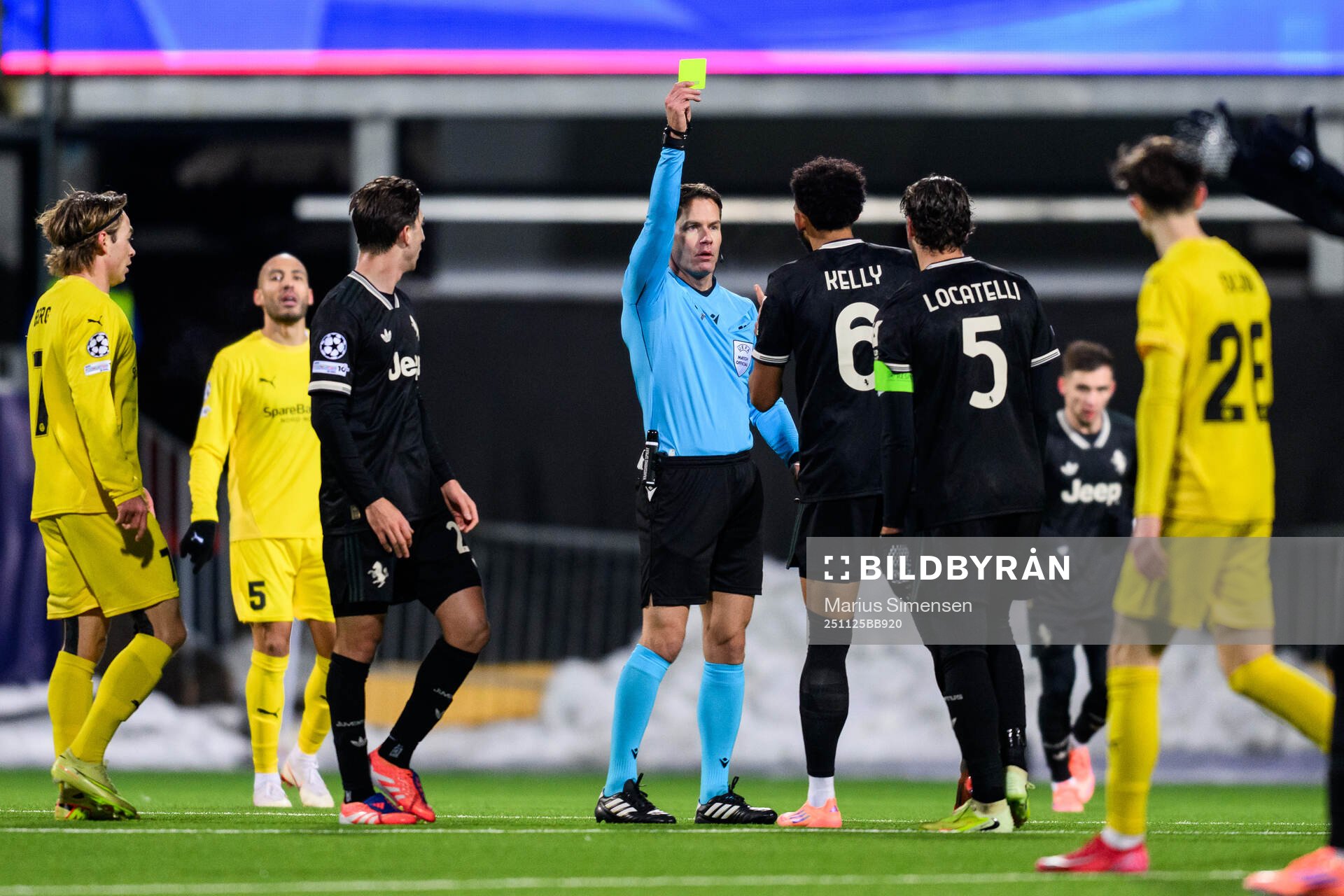 Lloyd Kelly of Juventus is shown a yellow card by Danny