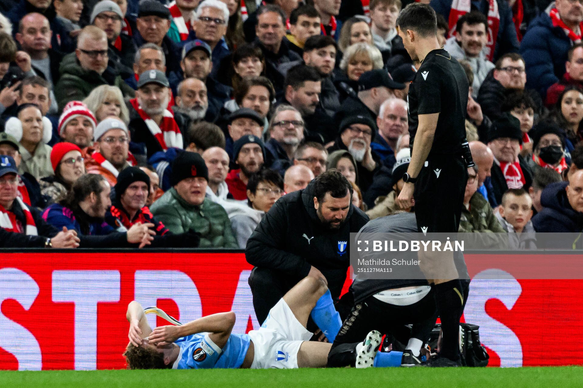 Hugo Bolin of Malmö FF receives medical treatment