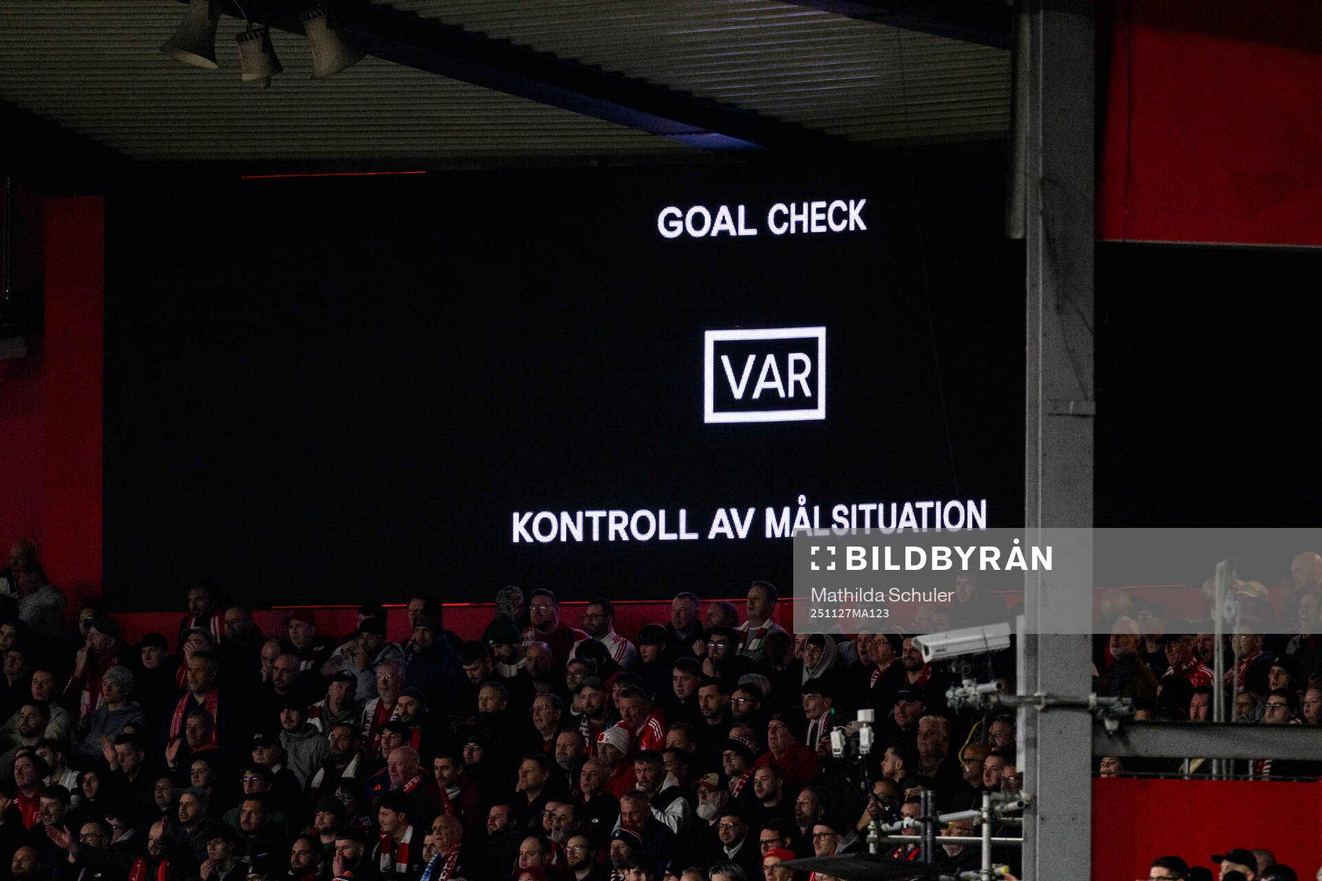 The big screen displays a VAR review message
