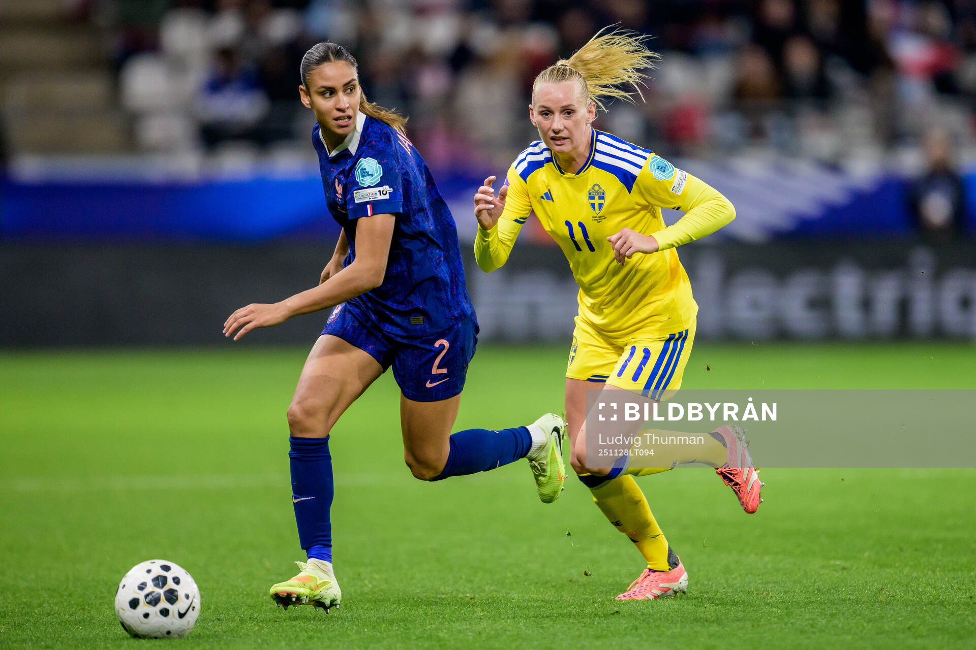 Maelle Lakrar of France and Stina Blackstenius of Sweden