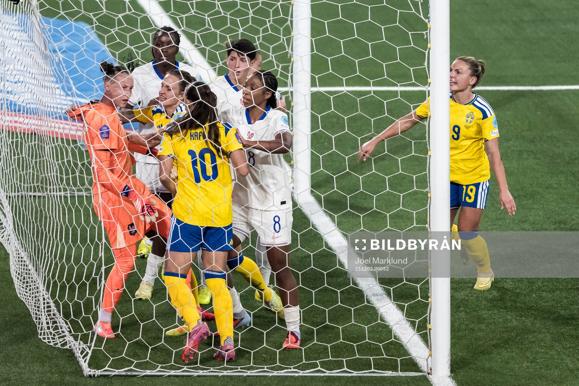 Goalkeeper Pauline Peyraud-Magnin of France argues with