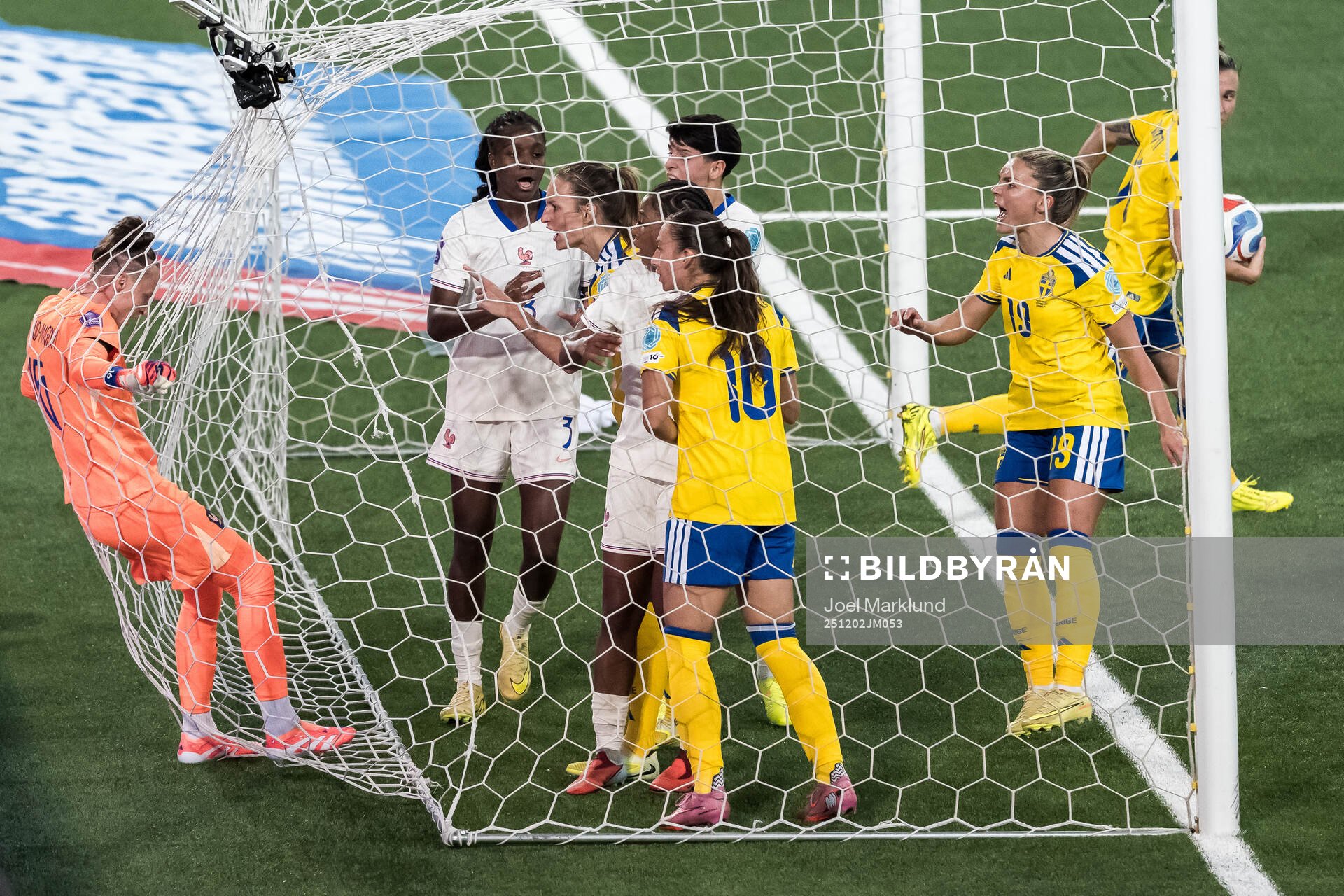 Goalkeeper Pauline Peyraud-Magnin of France argues with