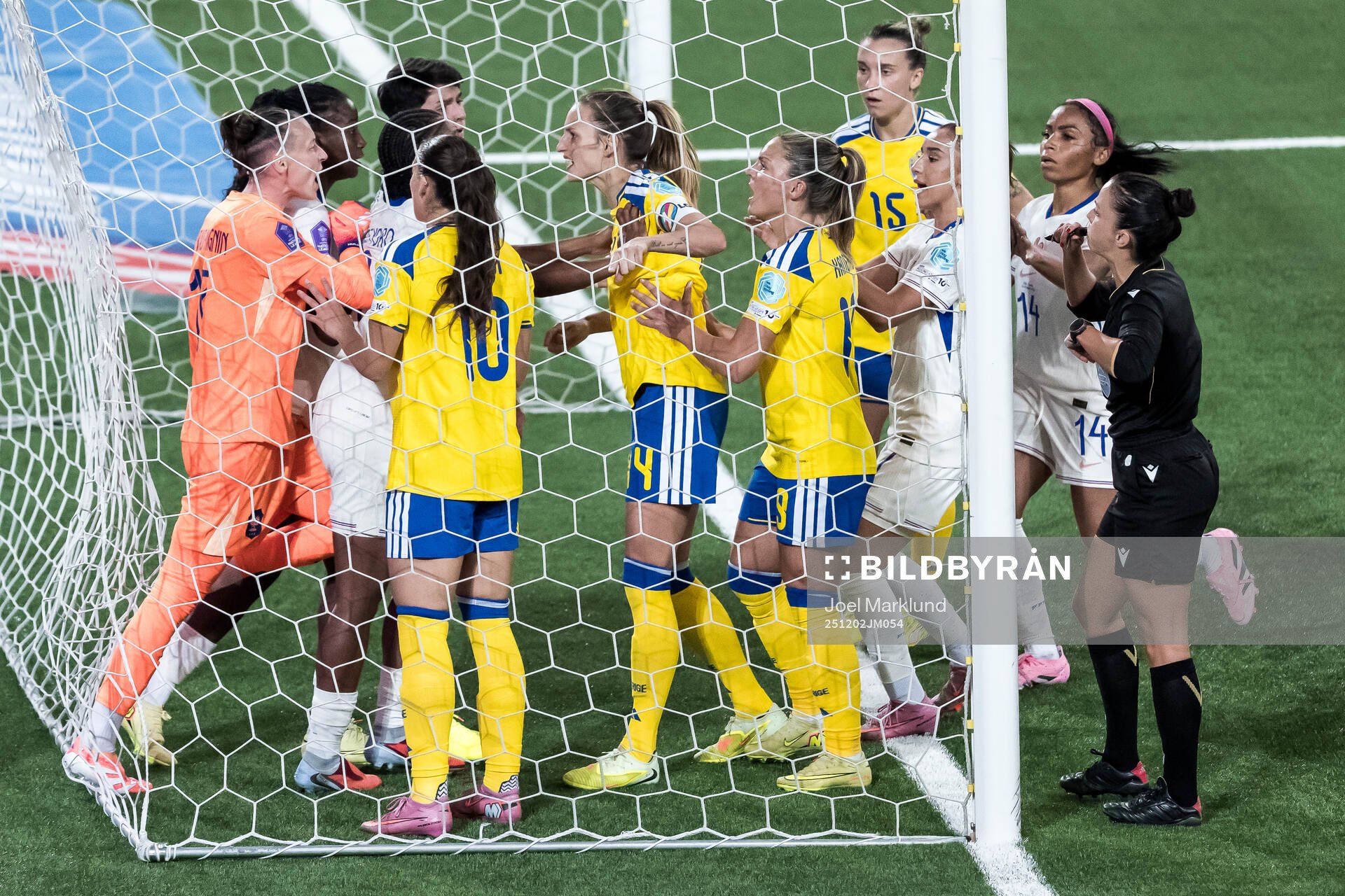 Goalkeeper Pauline Peyraud-Magnin of France argues with
